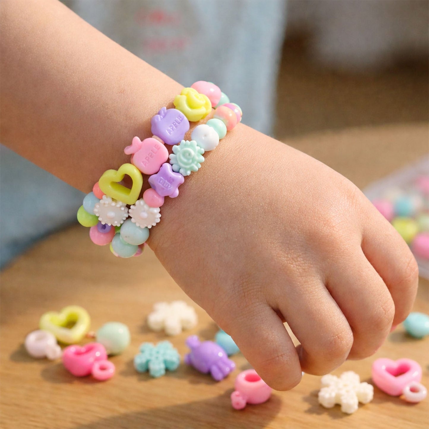 Elastic thread and heart charms included in the jewellery making kit for kids