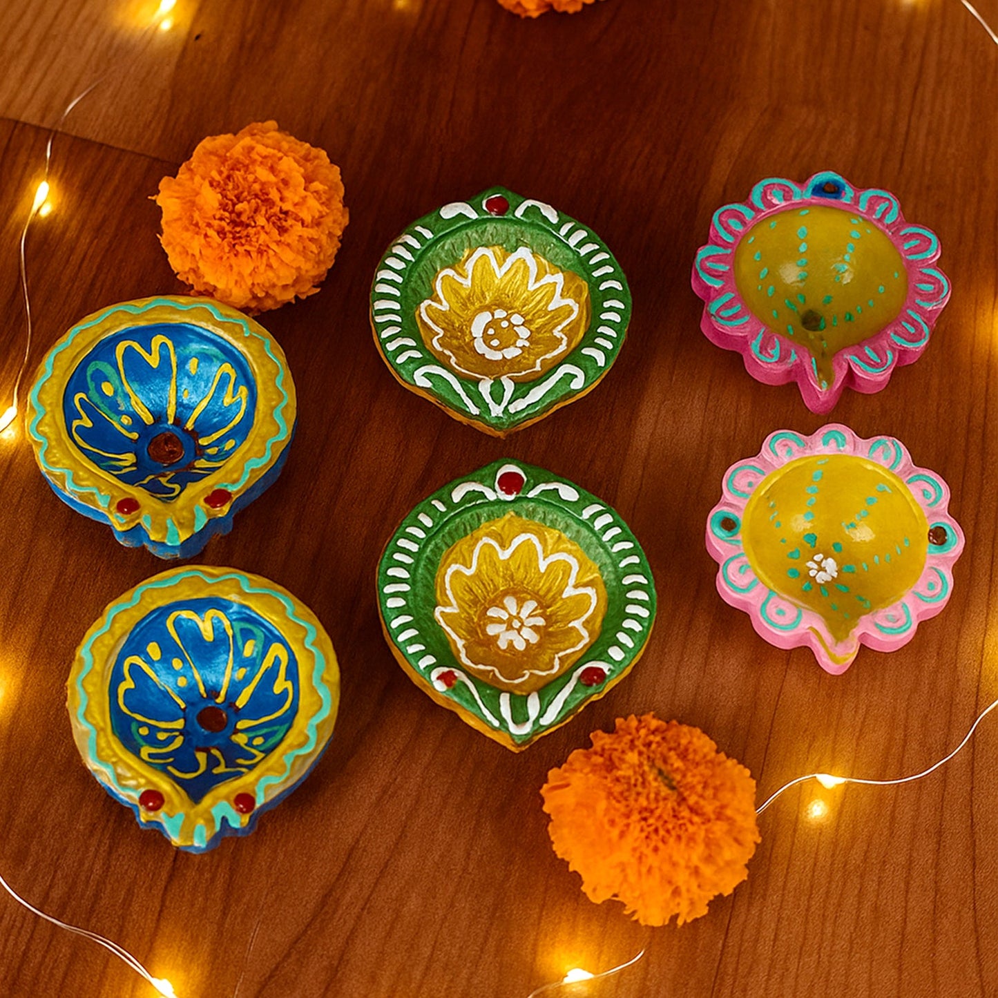 Collection of decorative clay diyas arranged for festival lighting
