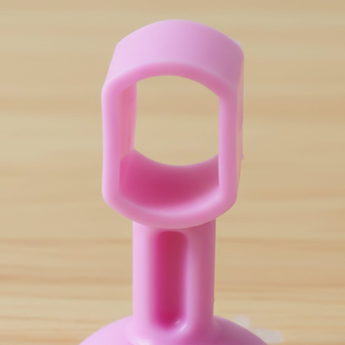 Soft silicone door stopper with suction base on wall