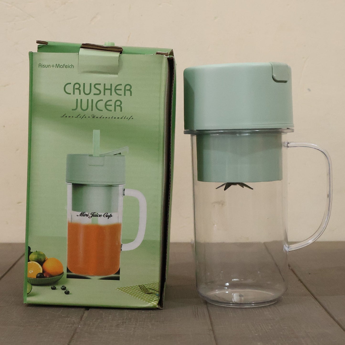 Portable electric juicer on table for drinks