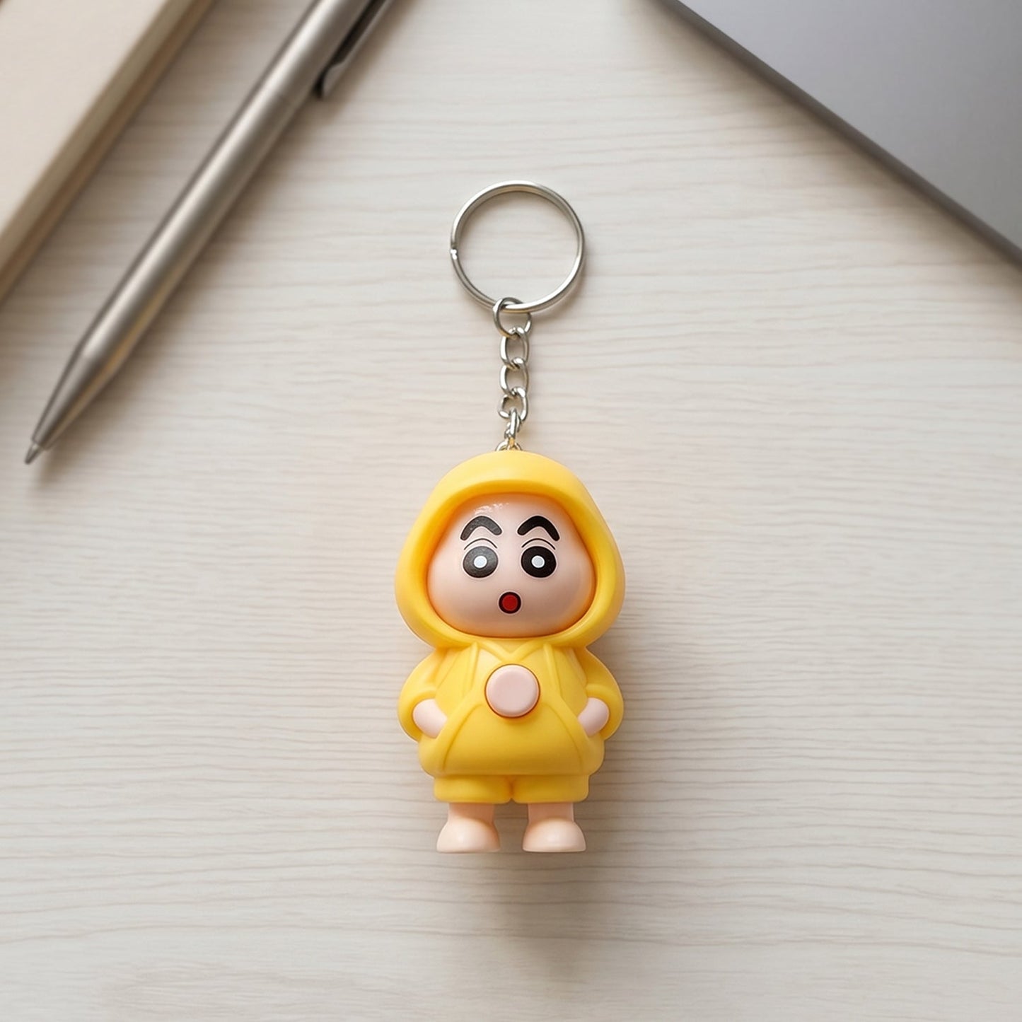 Back view of face-changing doll keychain showing switching mechanism