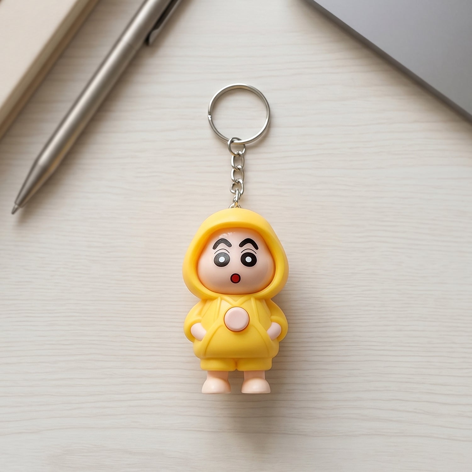 Back view of face-changing doll keychain showing switching mechanism