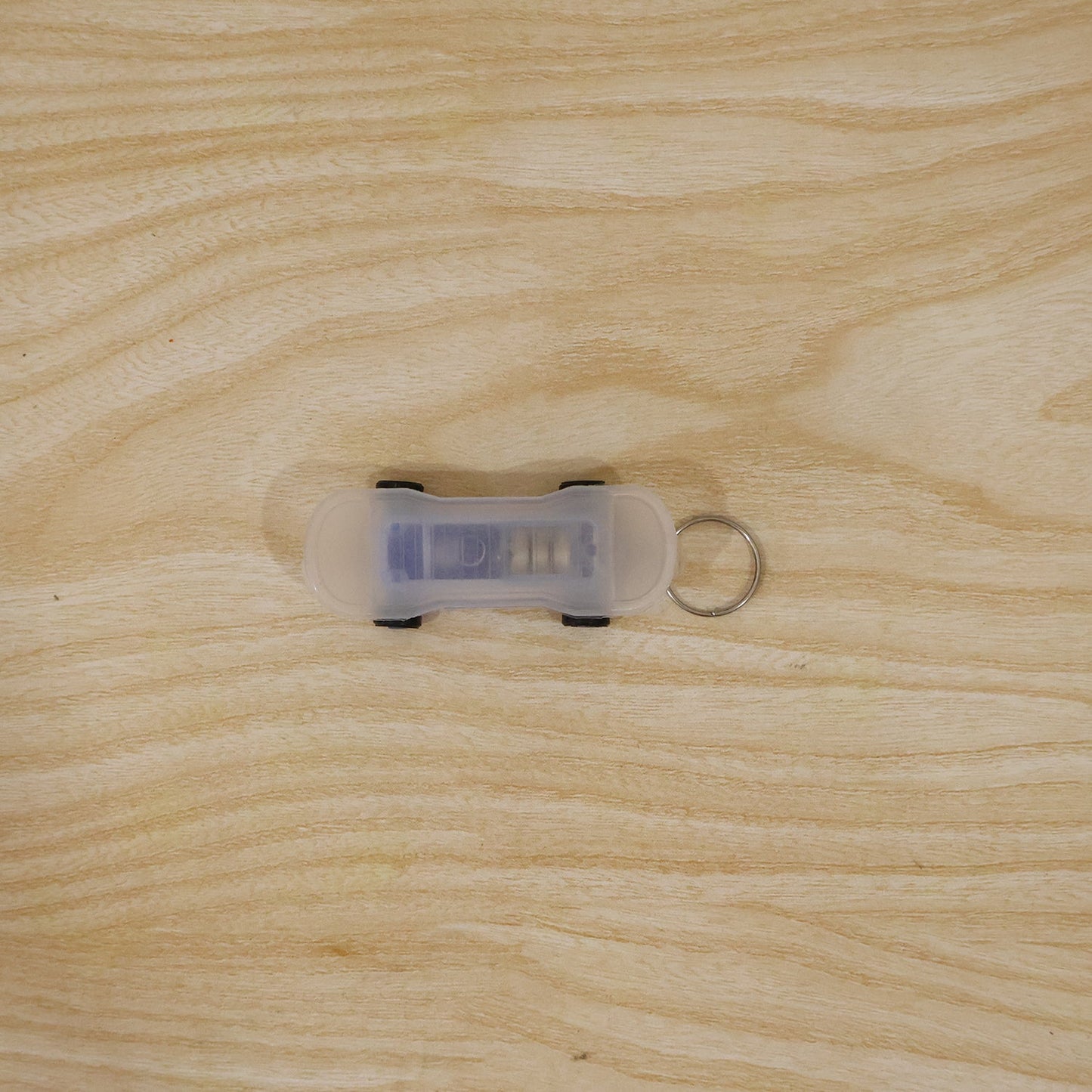Mini skateboard LED keychain in use