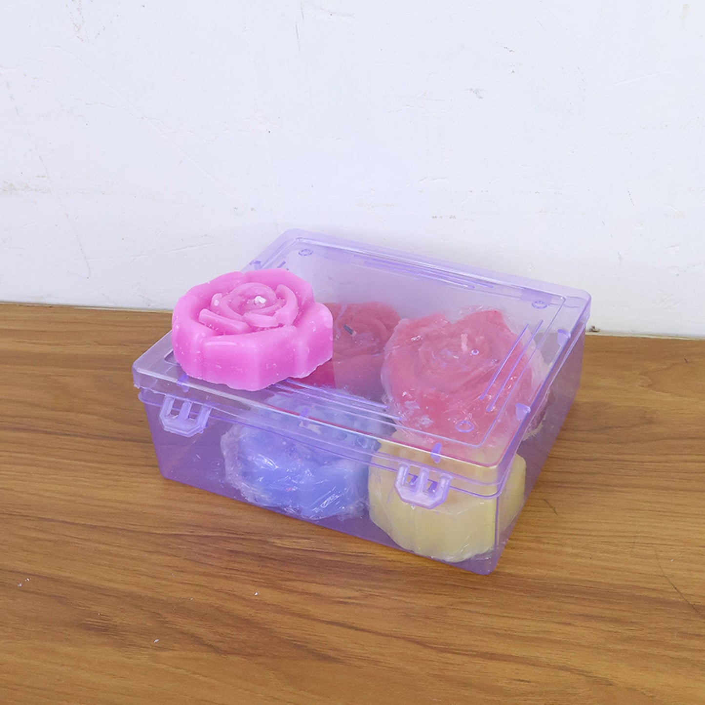 Rose shaped wax candles adding warm light to home décor and special occasions