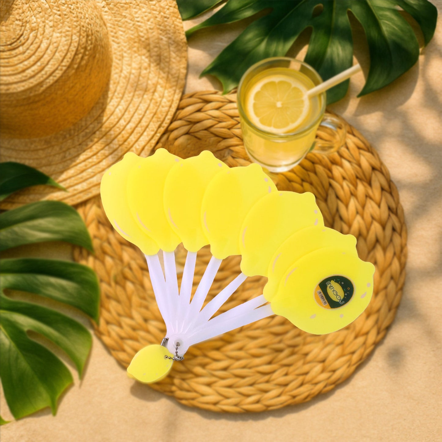 Compact foldable lemon hand fan attached to backpack keychain