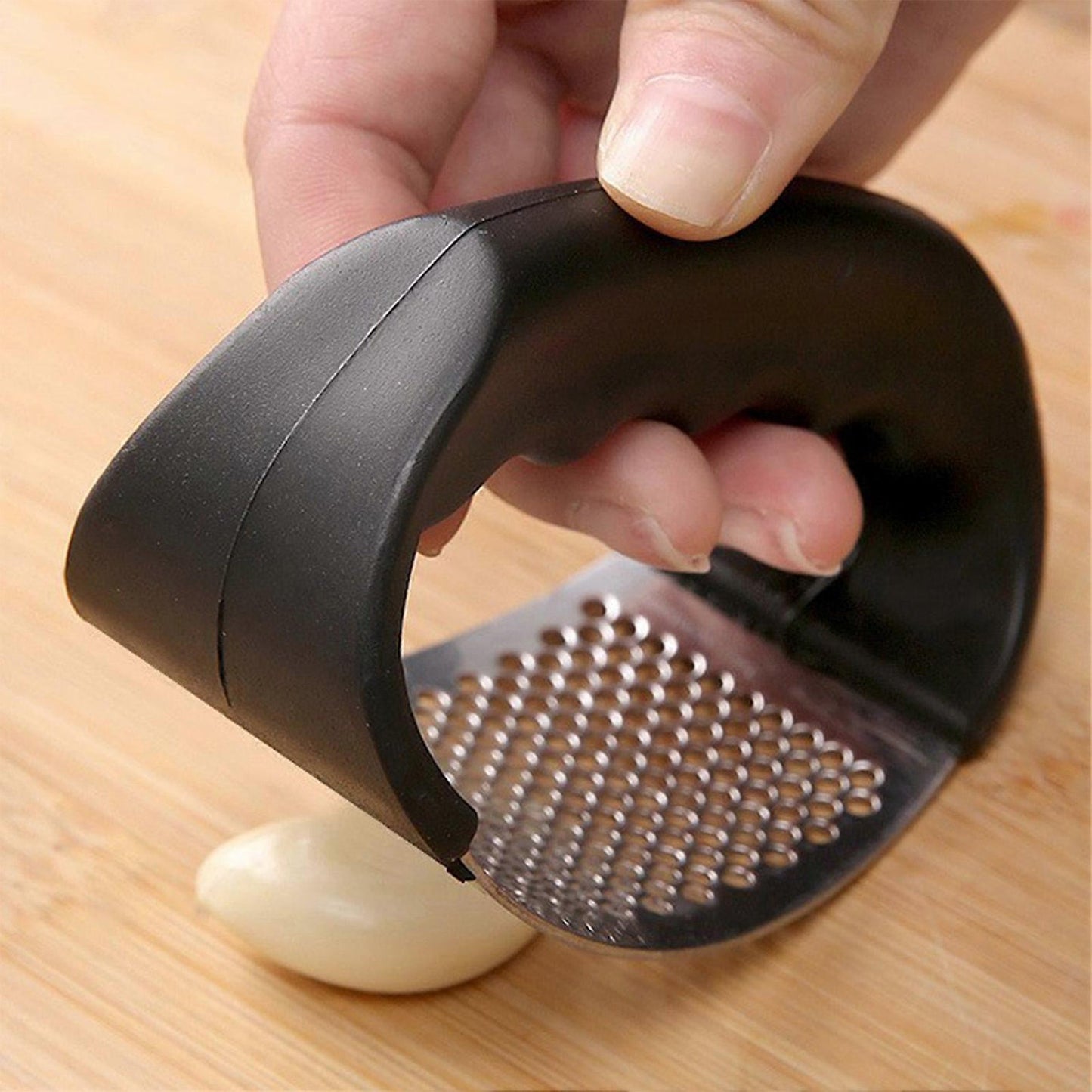 Curved garlic press crusher ideal for fresh garlic preparation