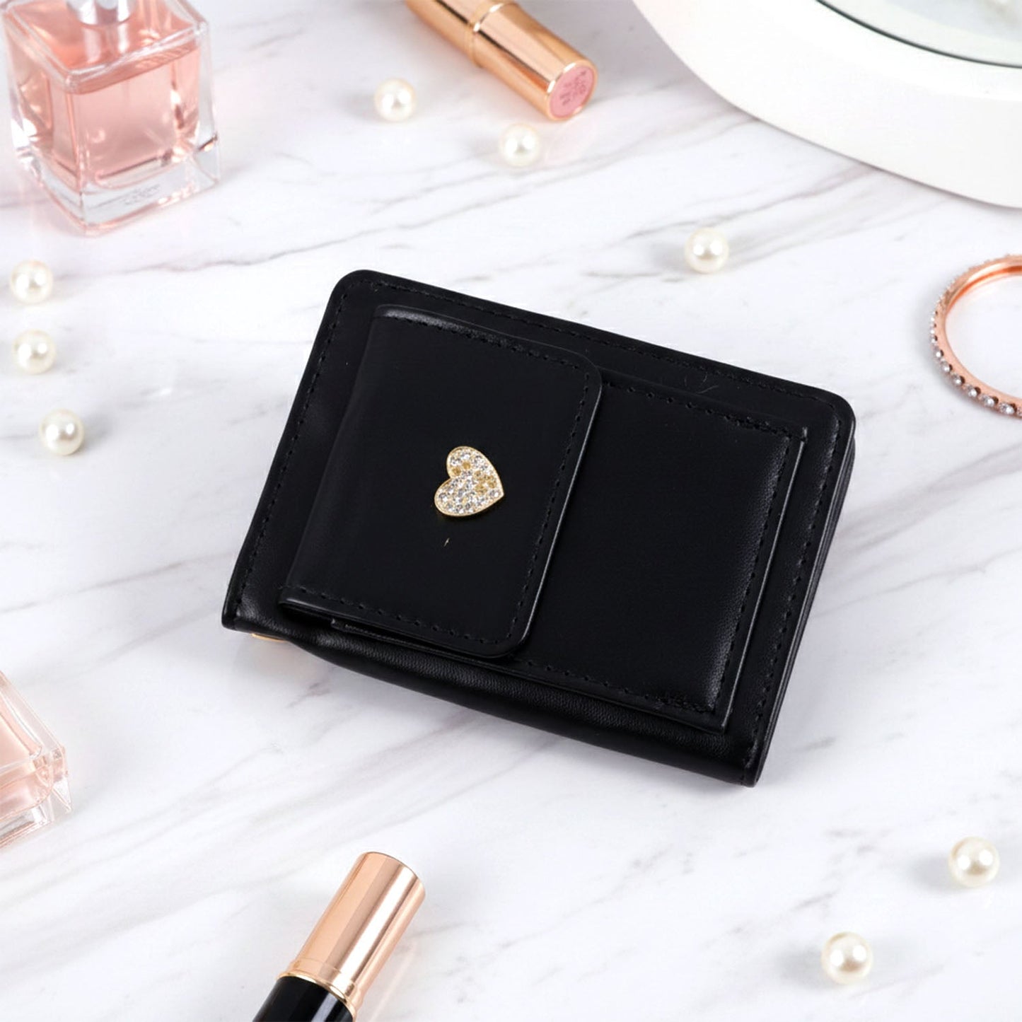 Compact wallet showing card slots and snap button closure