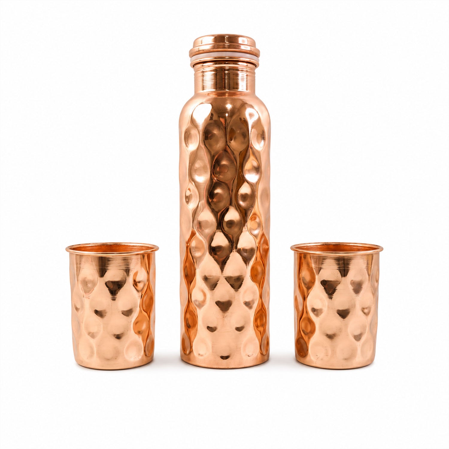 Detailed view of the sleek design and polished finish of the copper drinking glasses.