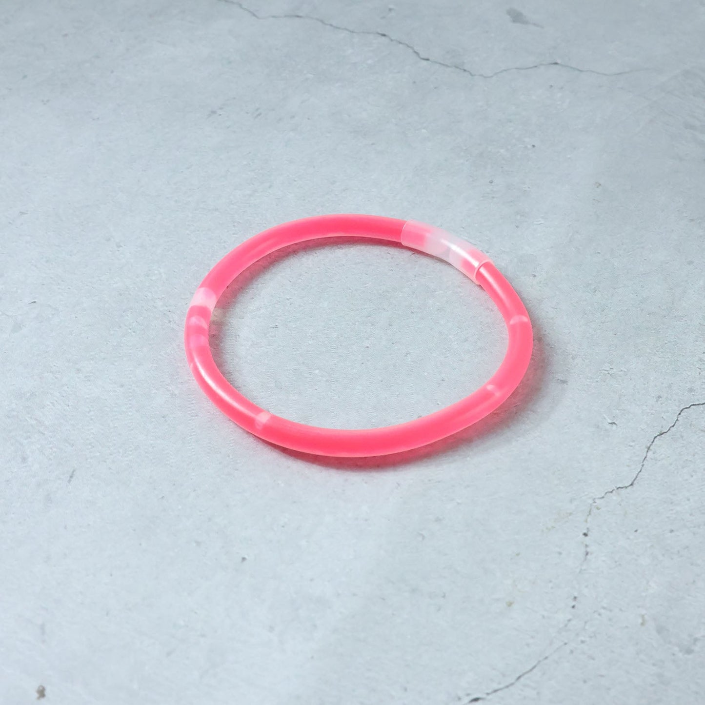 Person enjoying a concert while wearing a bright Glow LED Bracelet.