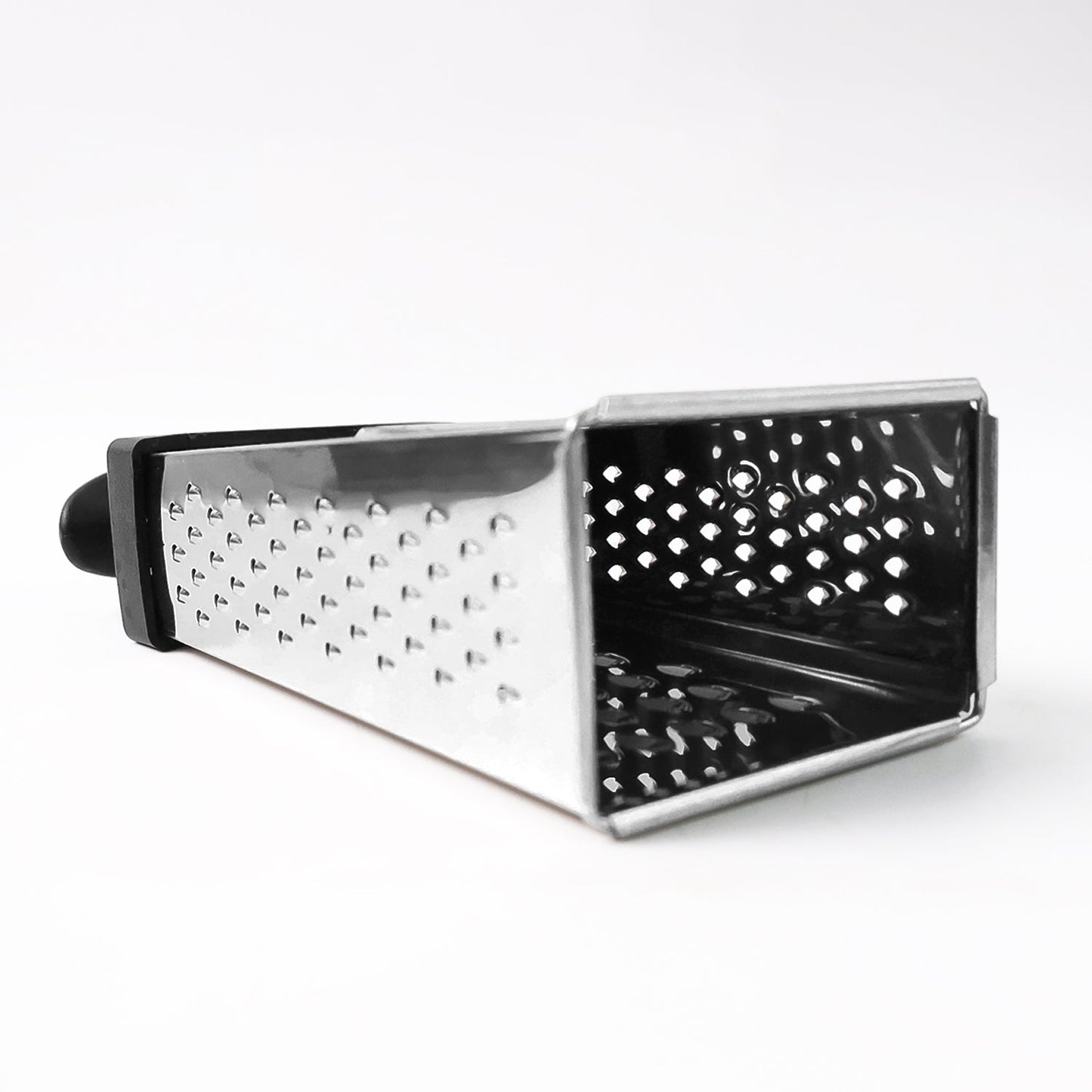 Fine and coarse grater surfaces of stainless steel 4-in-1 grater with handle