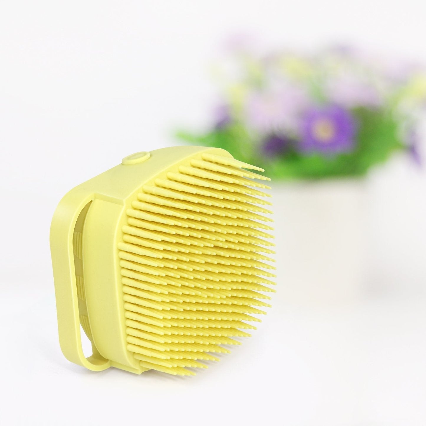 Hygienic silicone body brush with built-in shampoo dispenser for a complete shower.