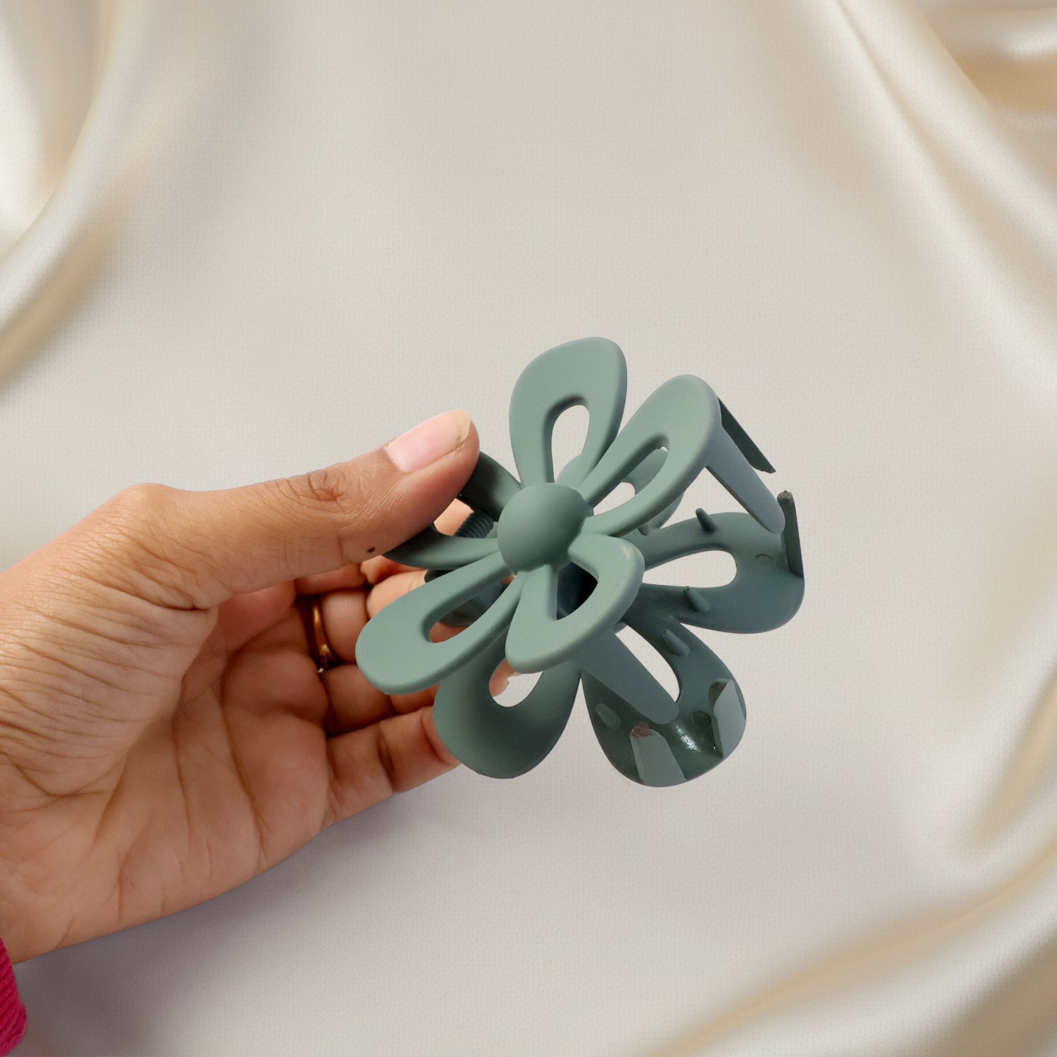 Flower shaped hair claw clip in soft neutral tones