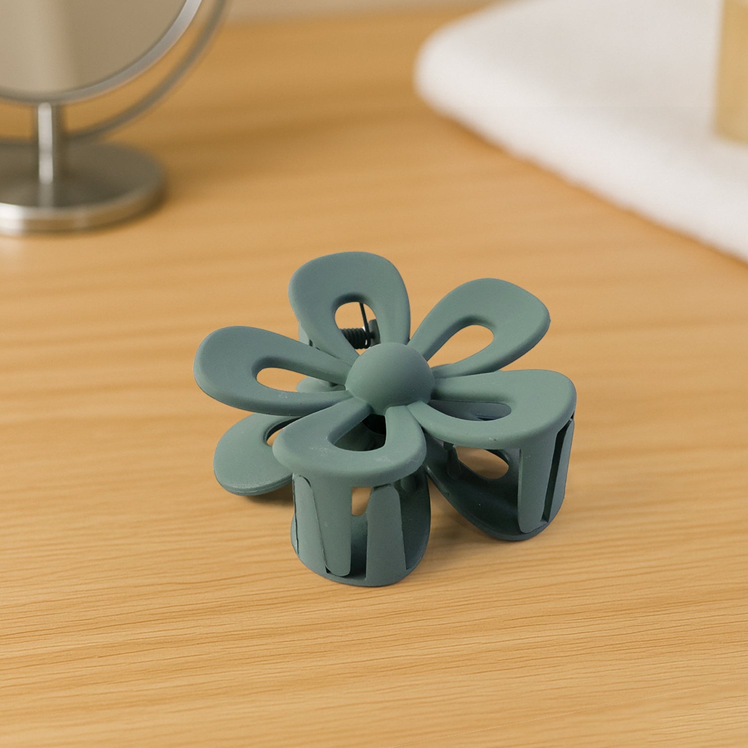 Side view of a flower hair claw clip showing its comfortable grip