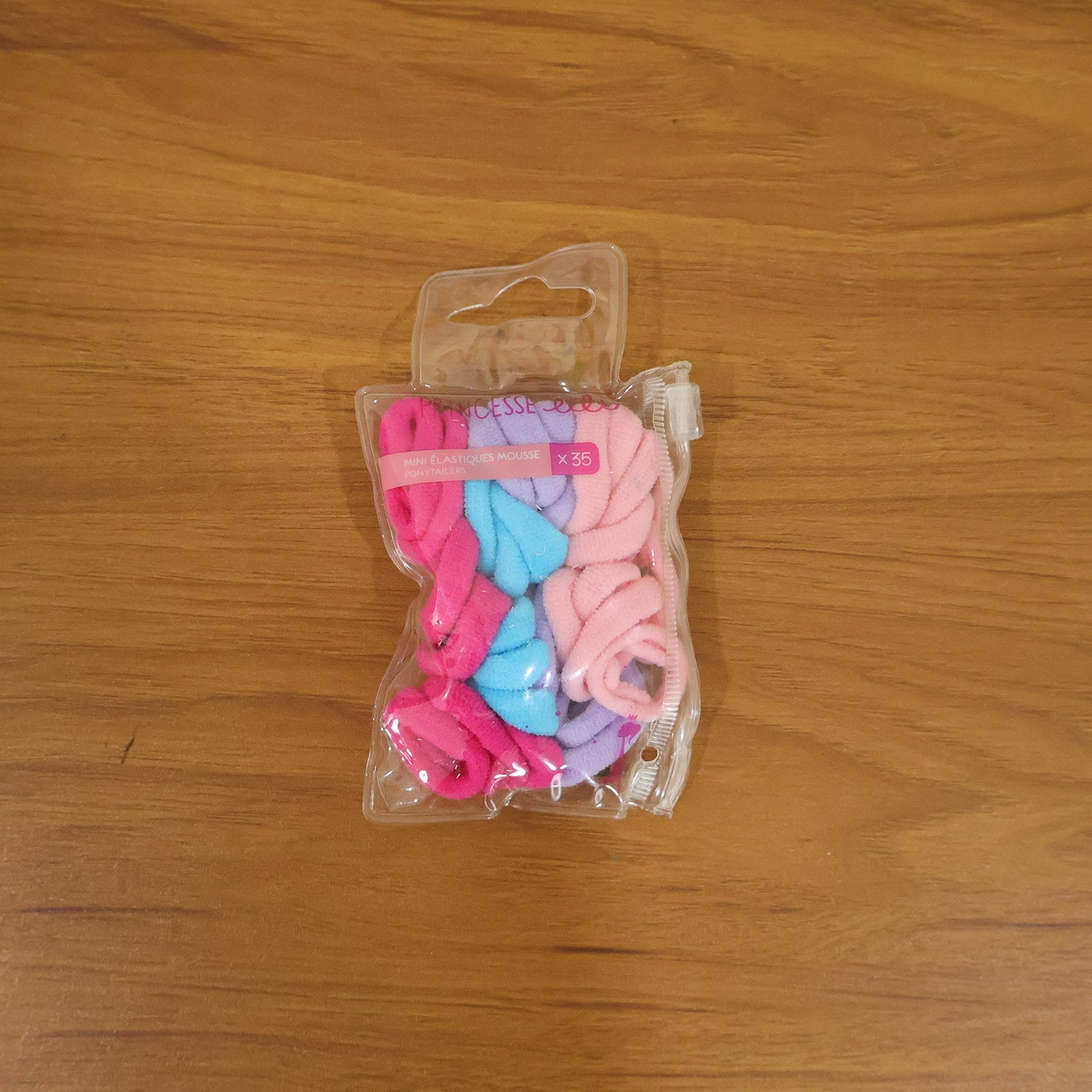 Multicolor elastic hair bands in use for playful styling