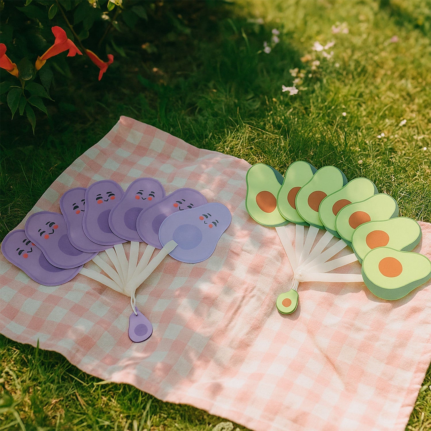 Handheld foldable fan being used for personal cooling outdoors