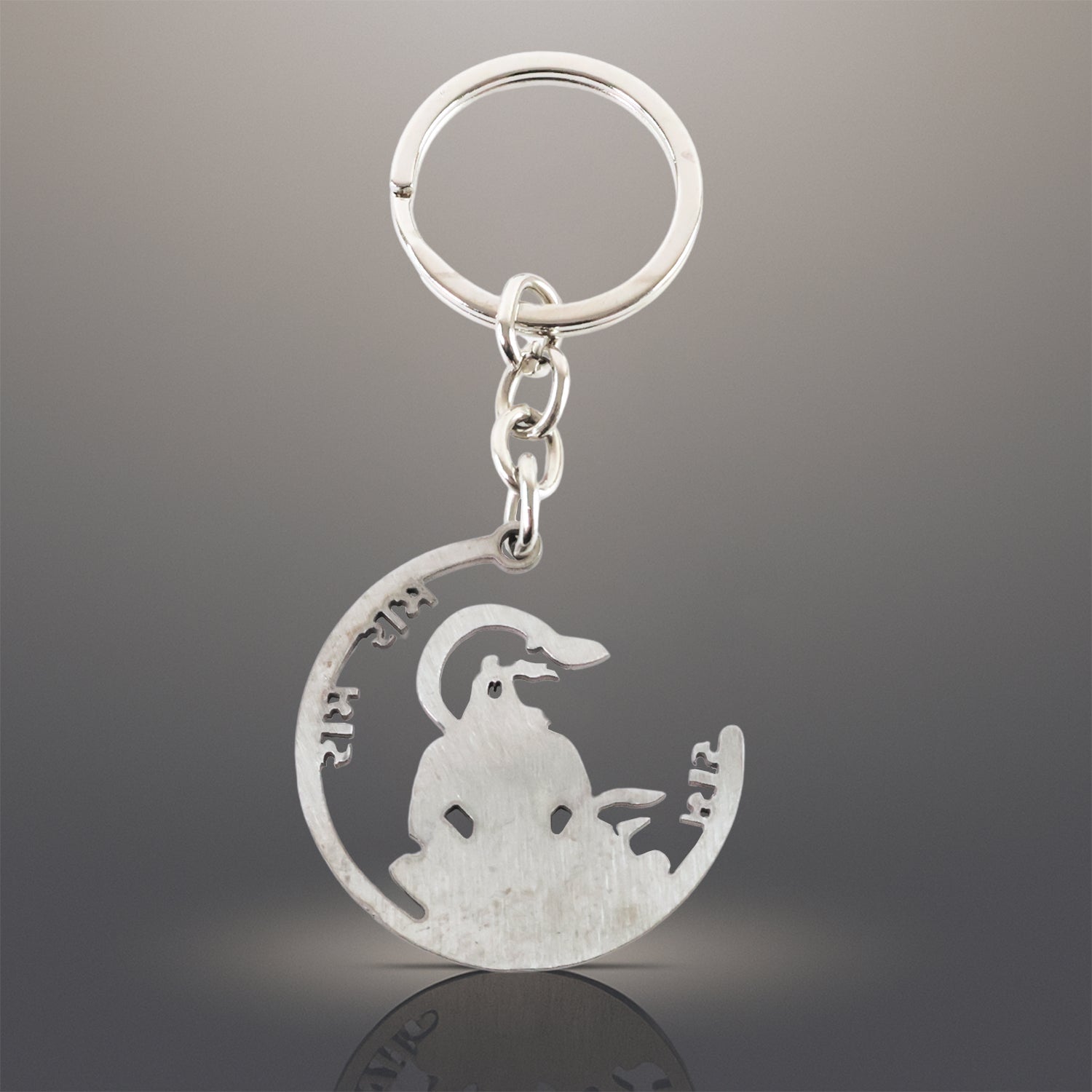 Jai Shri Ram Keychain attached to a set of keys, highlighting its secure ring.