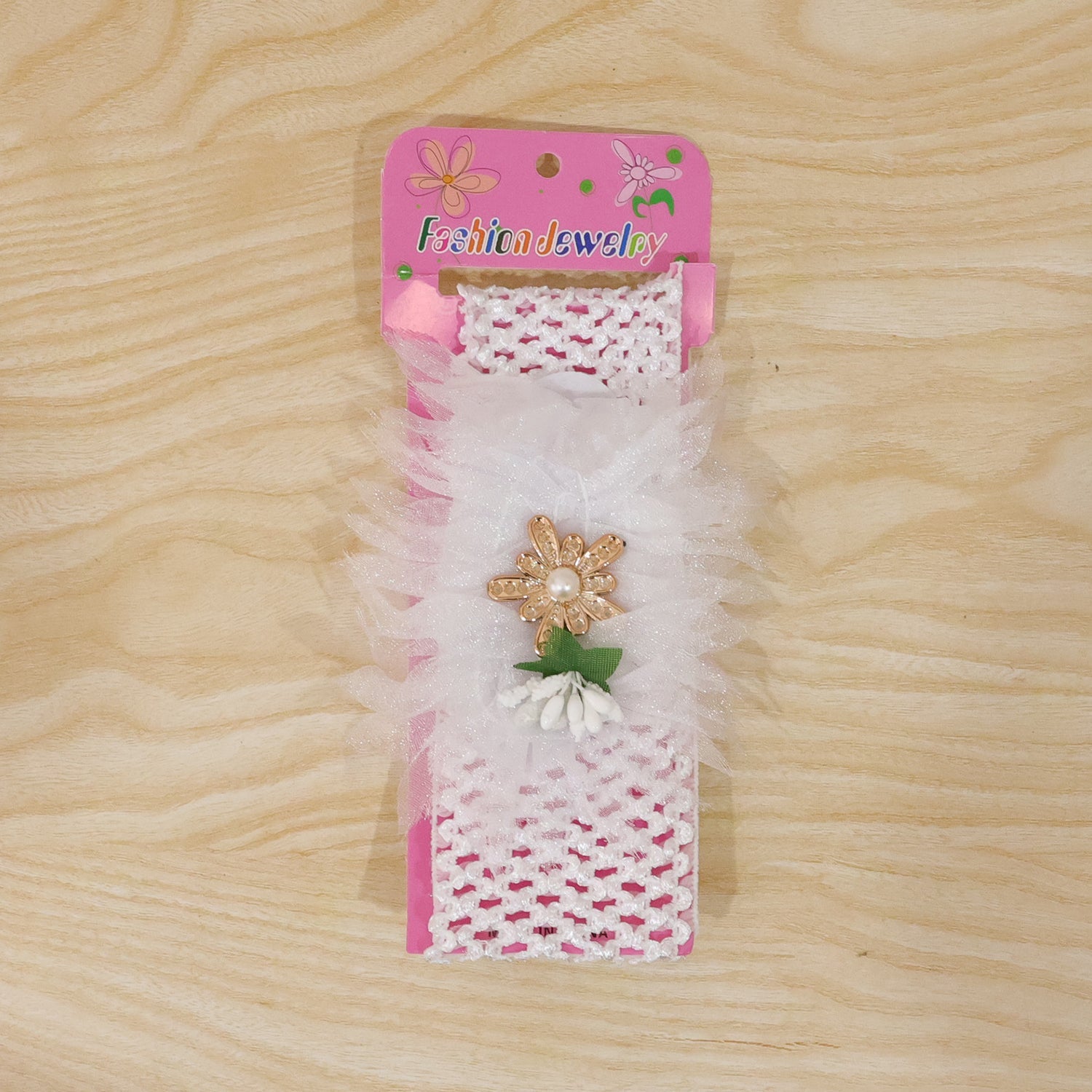 Cute baby girl headband with floral decoration, perfect for photoshoots