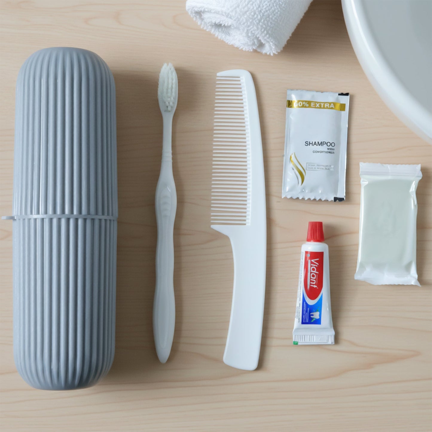 Travel grooming kit neatly packed showing slippers and toiletry essentials