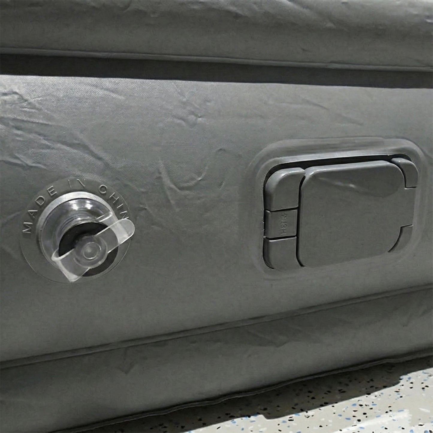 Portable inflatable bed partially folded illustrating compact and lightweight design