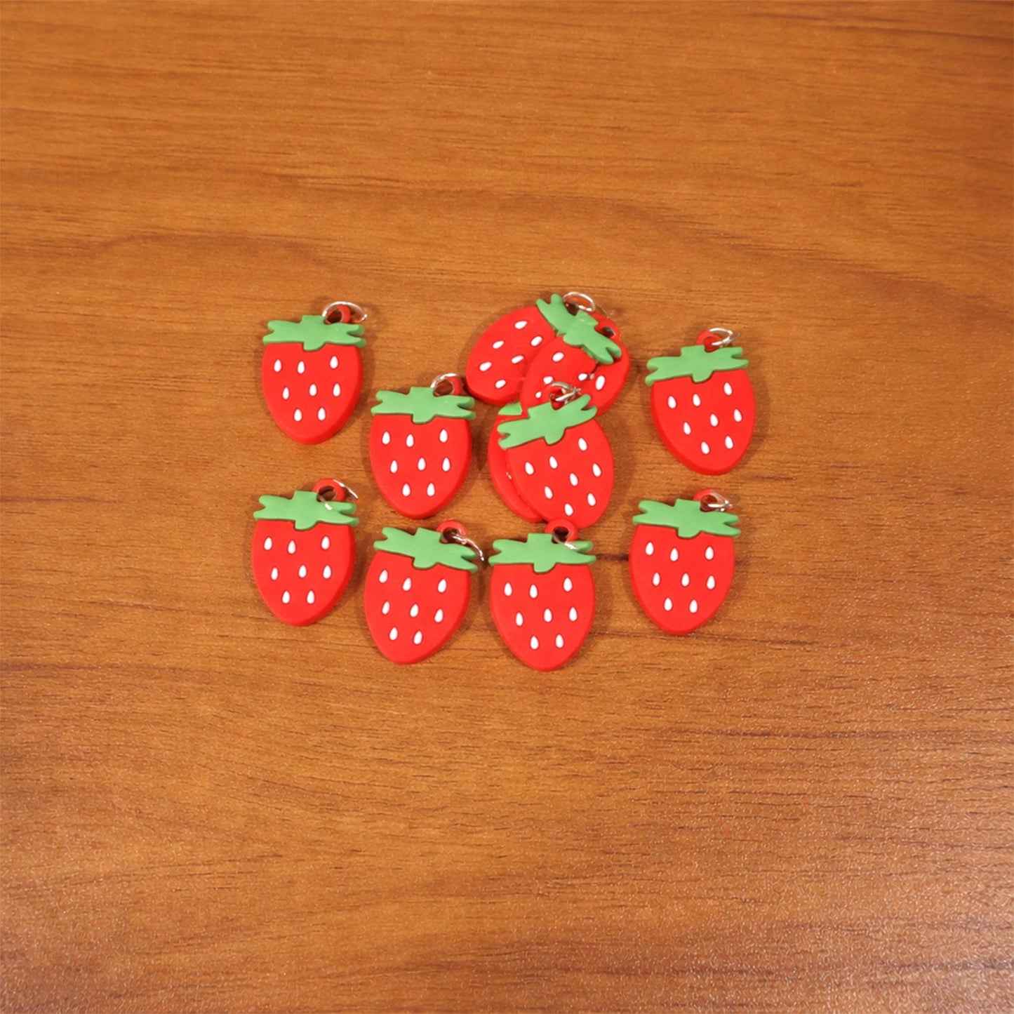 Colorful set of strawberry-themed keychain accessories