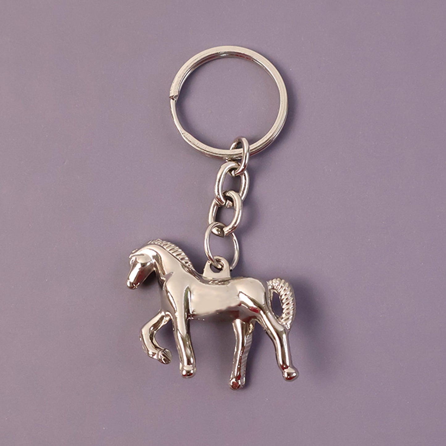 Stylish chrome horse shape keychain attached to key ring