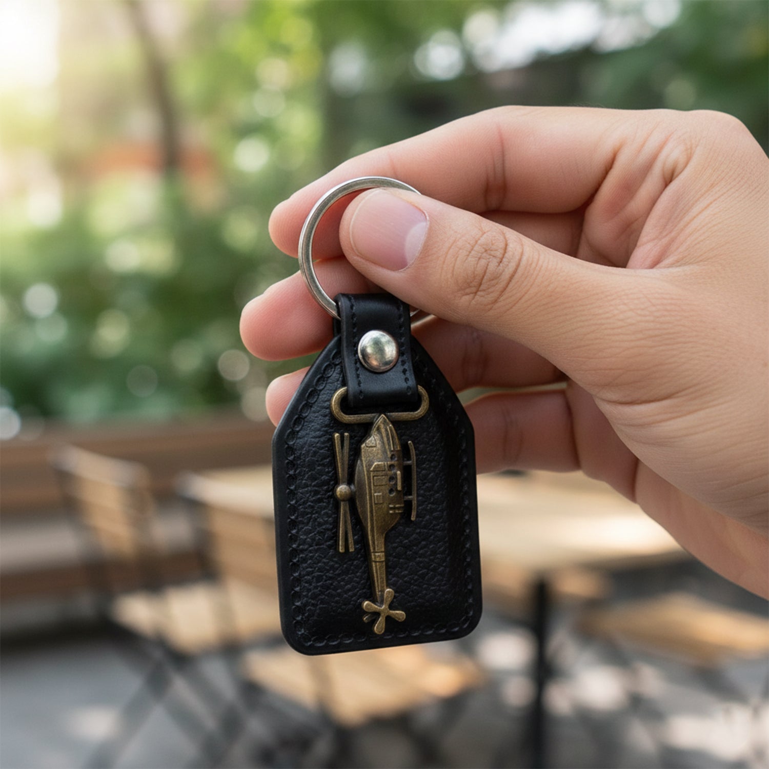 Back view of leather and metal sword emblem keychain