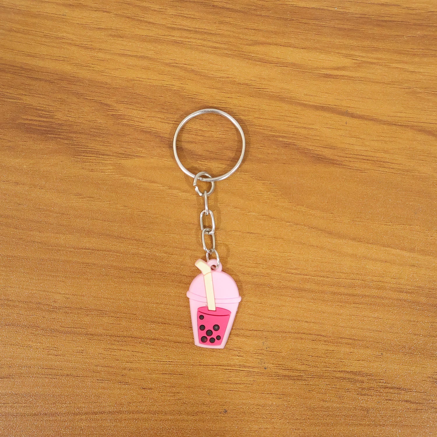 Lifestyle image showing bubble tea keychain as a trendy bag charm