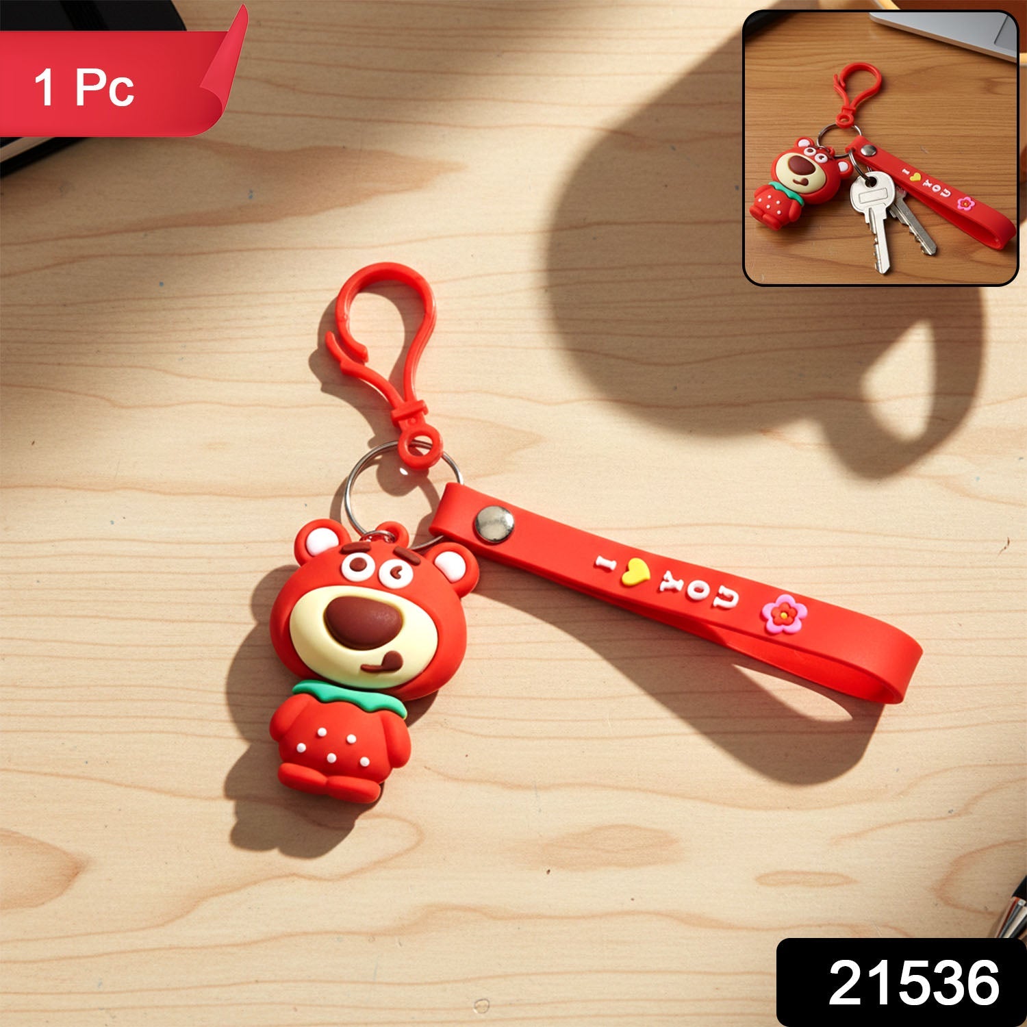 Close-up of cartoon bear figure keychain showcasing key ring and clip