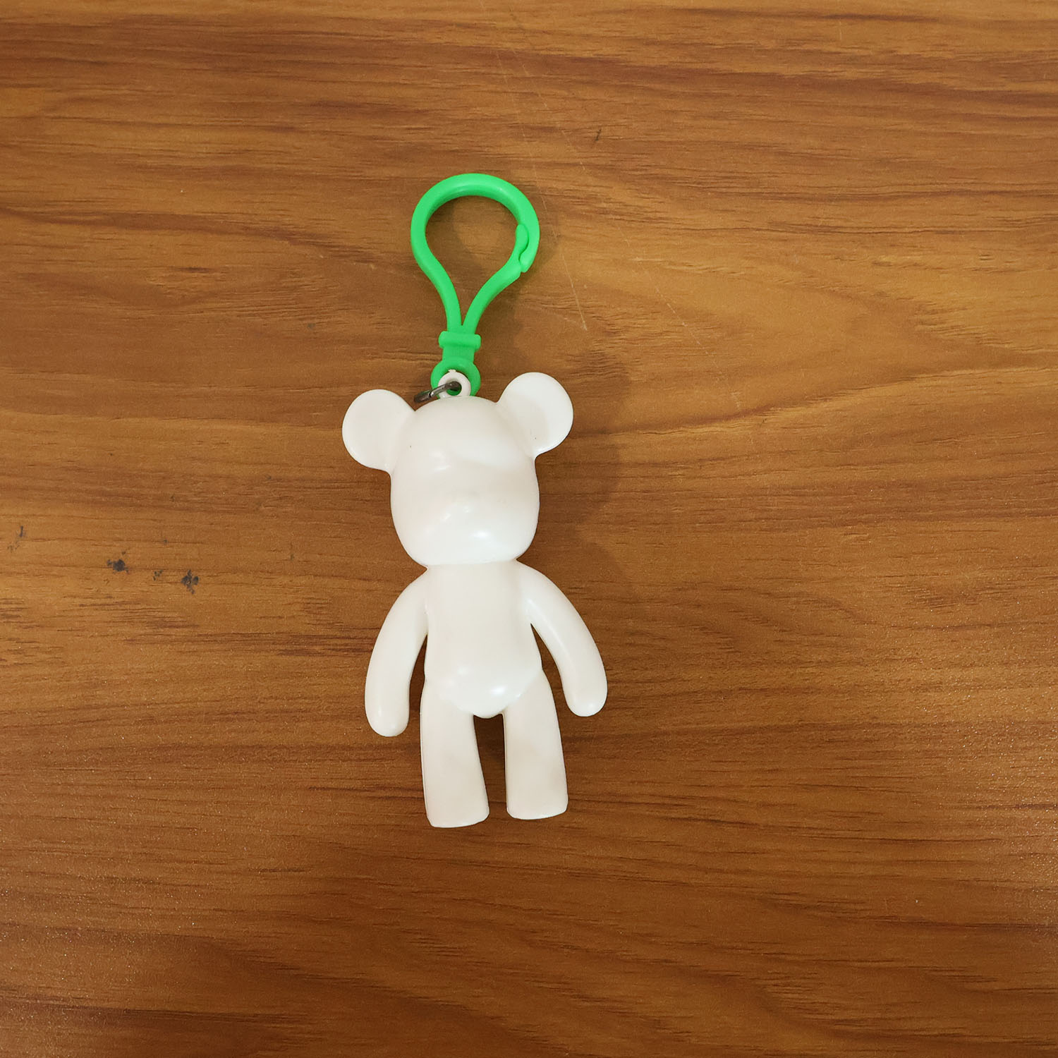 Lifestyle image of bear shape decorative keychain attached to daily accessories