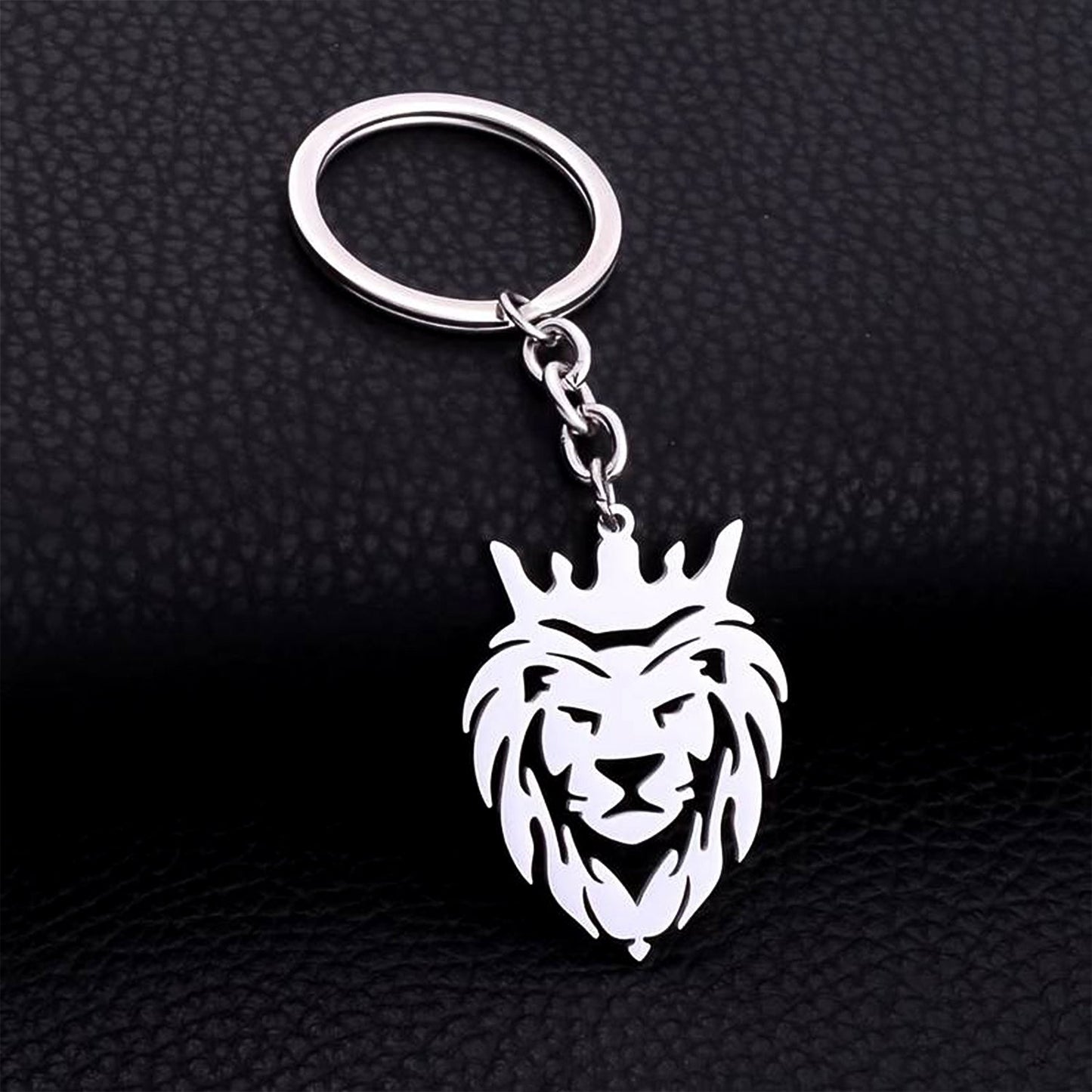 Durable stainless steel lion head keychain with crown design on a white background