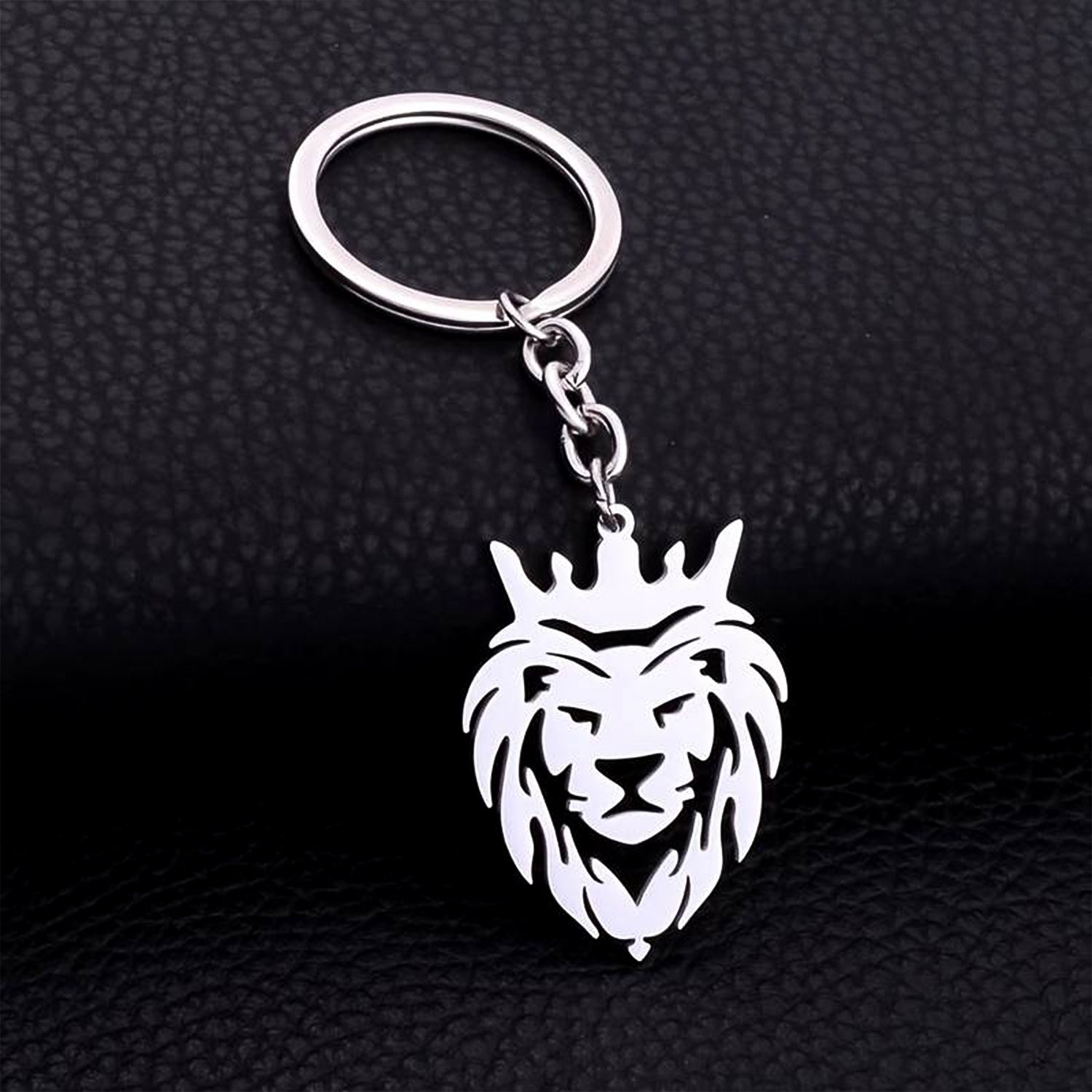 Durable stainless steel lion head keychain with crown design on a white background