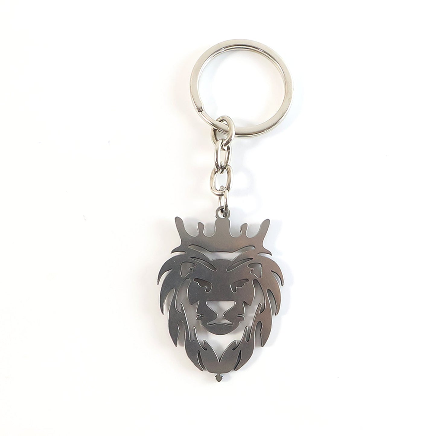 Angled view of metal lion head keychain highlighting textured craftsmanship