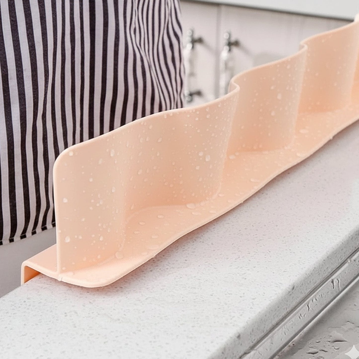 Silicone-based non-slip kitchen edge splash guard in use