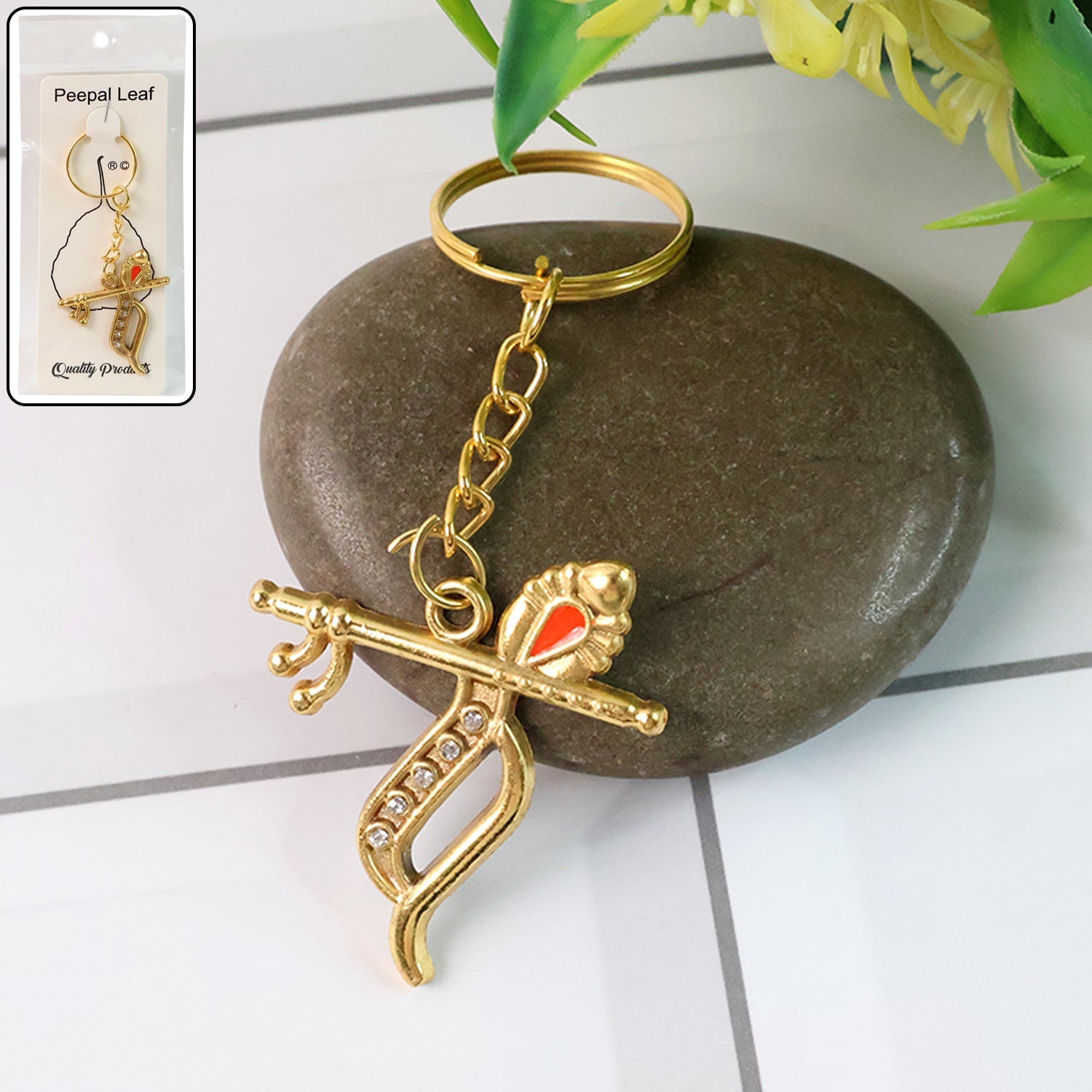 Krishna metal keychain featuring flute and peacock feather design