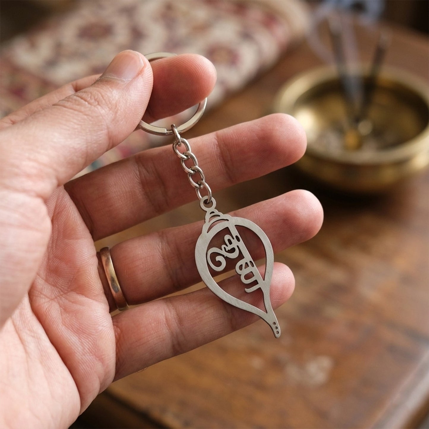 Spiritual Krishna shankh engraved keychain