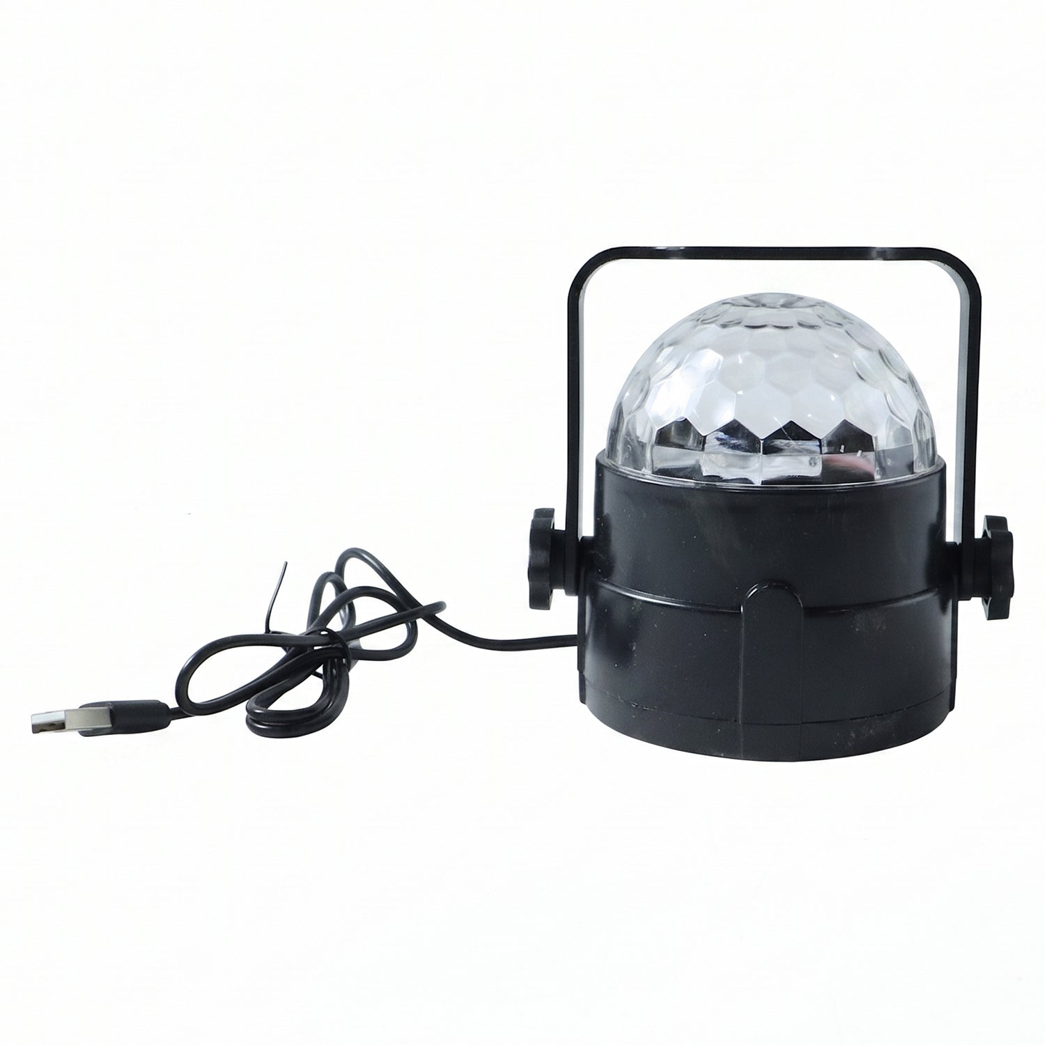 Hand holding the small USB powered star projector light, highlighting its compact size.