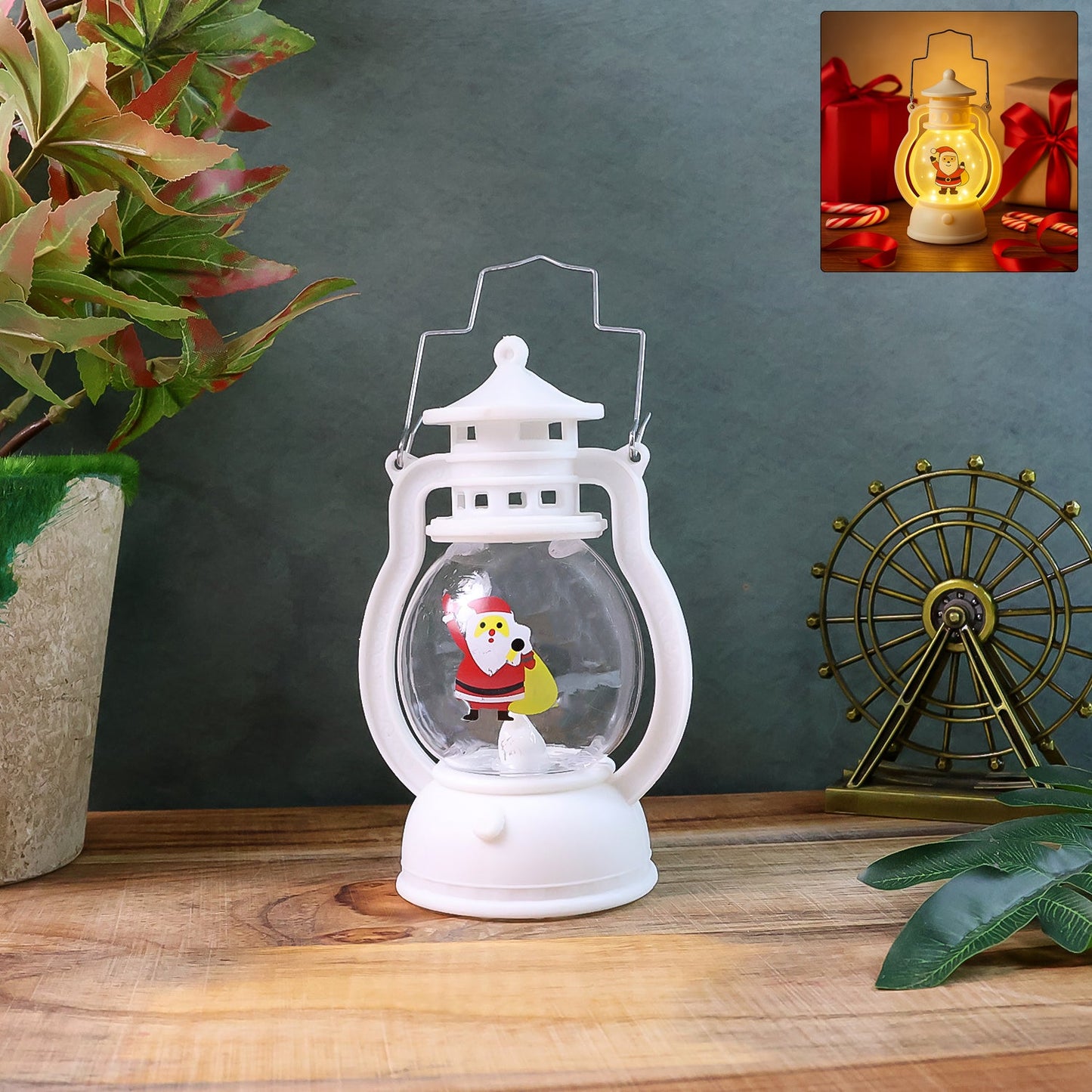 Mini Santa LED lantern glowing with warm light on a wooden surface.