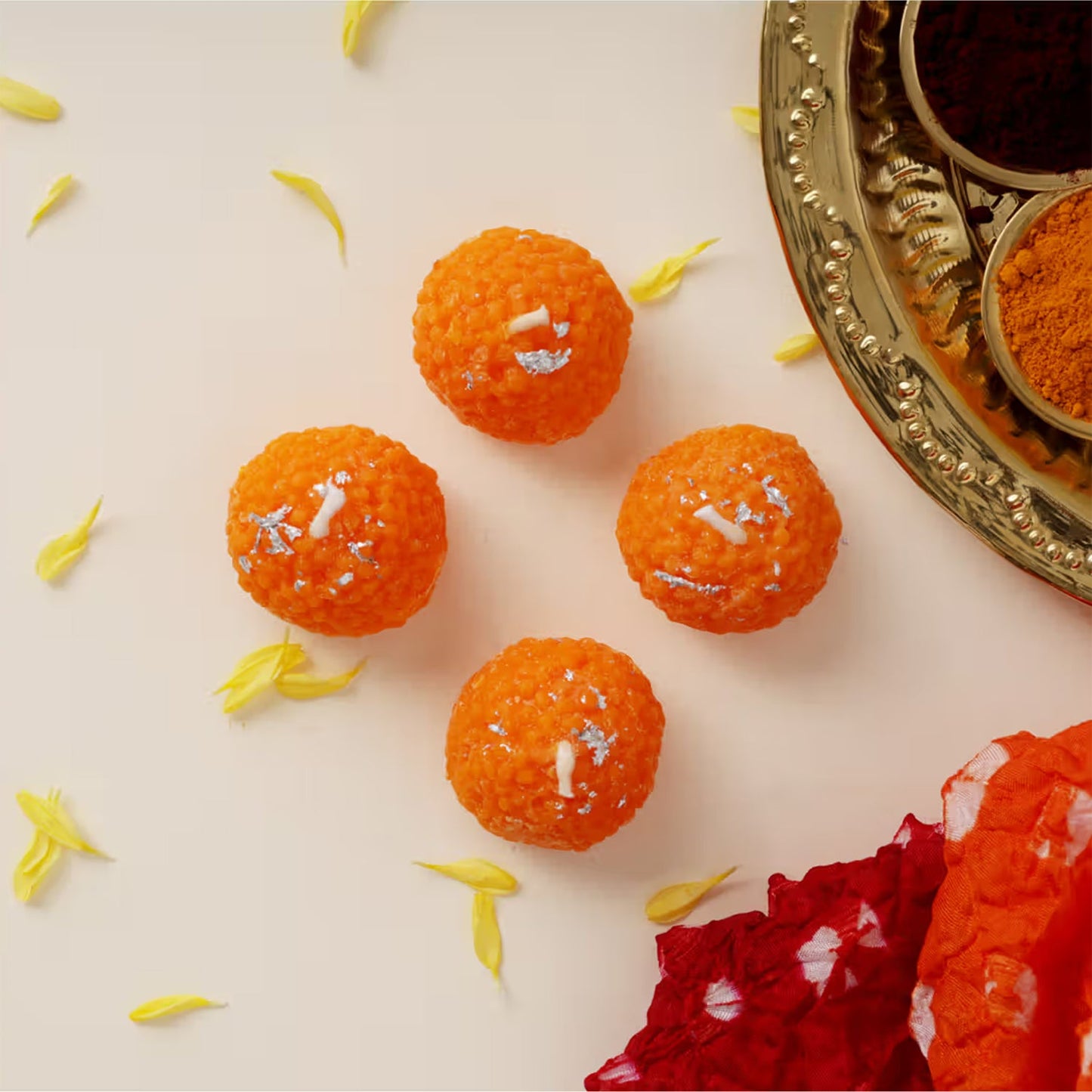 Festive table decoration with laddu shaped decorative wax candles lit