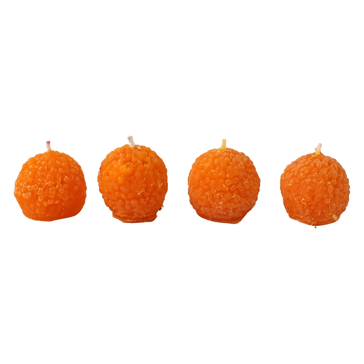 Four laddu shaped wax candles packaged in gift-ready box for gifting