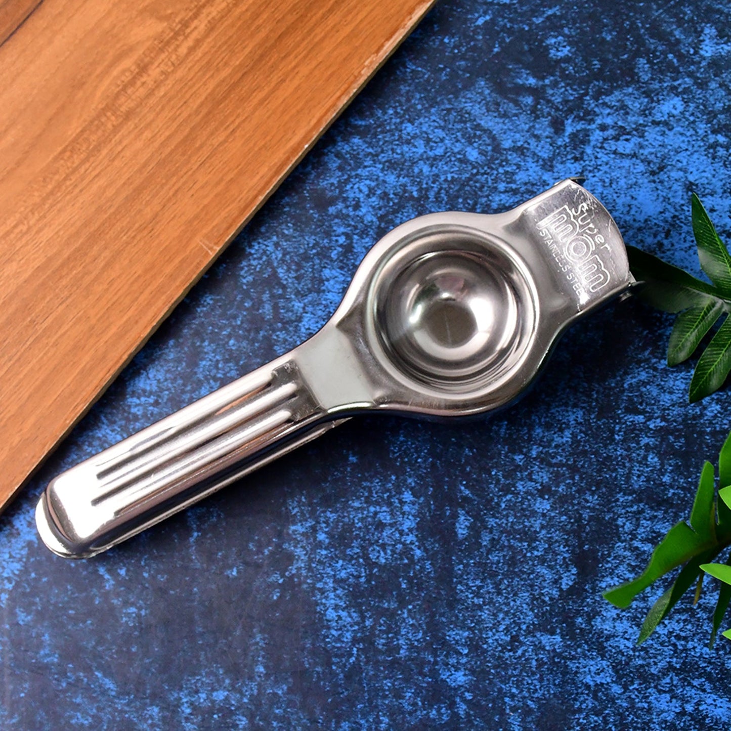 Manual steel lemon juicer showing ergonomic handles for comfortable grip