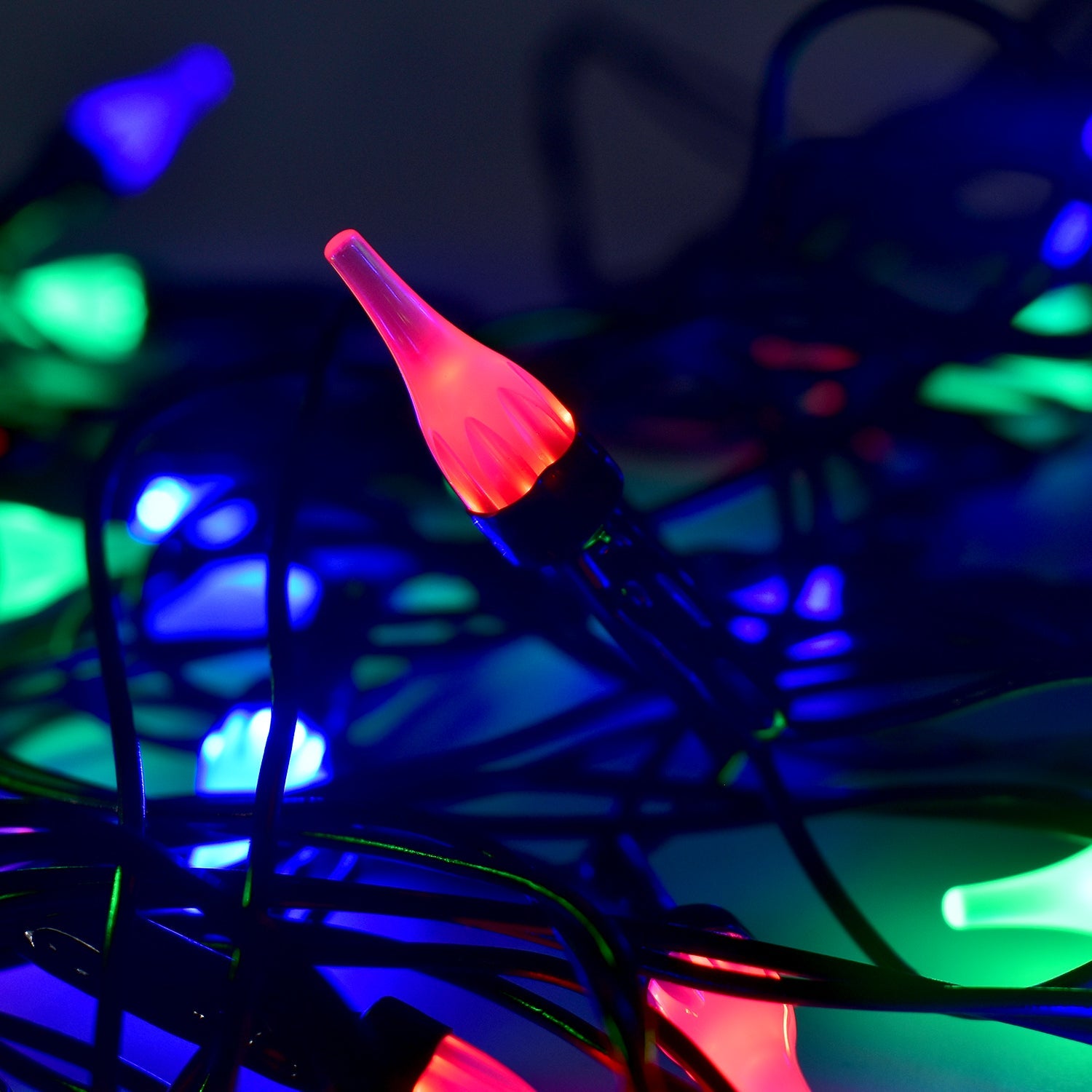 Multi-color LED string light displaying energy-efficient bulbs on flexible wire