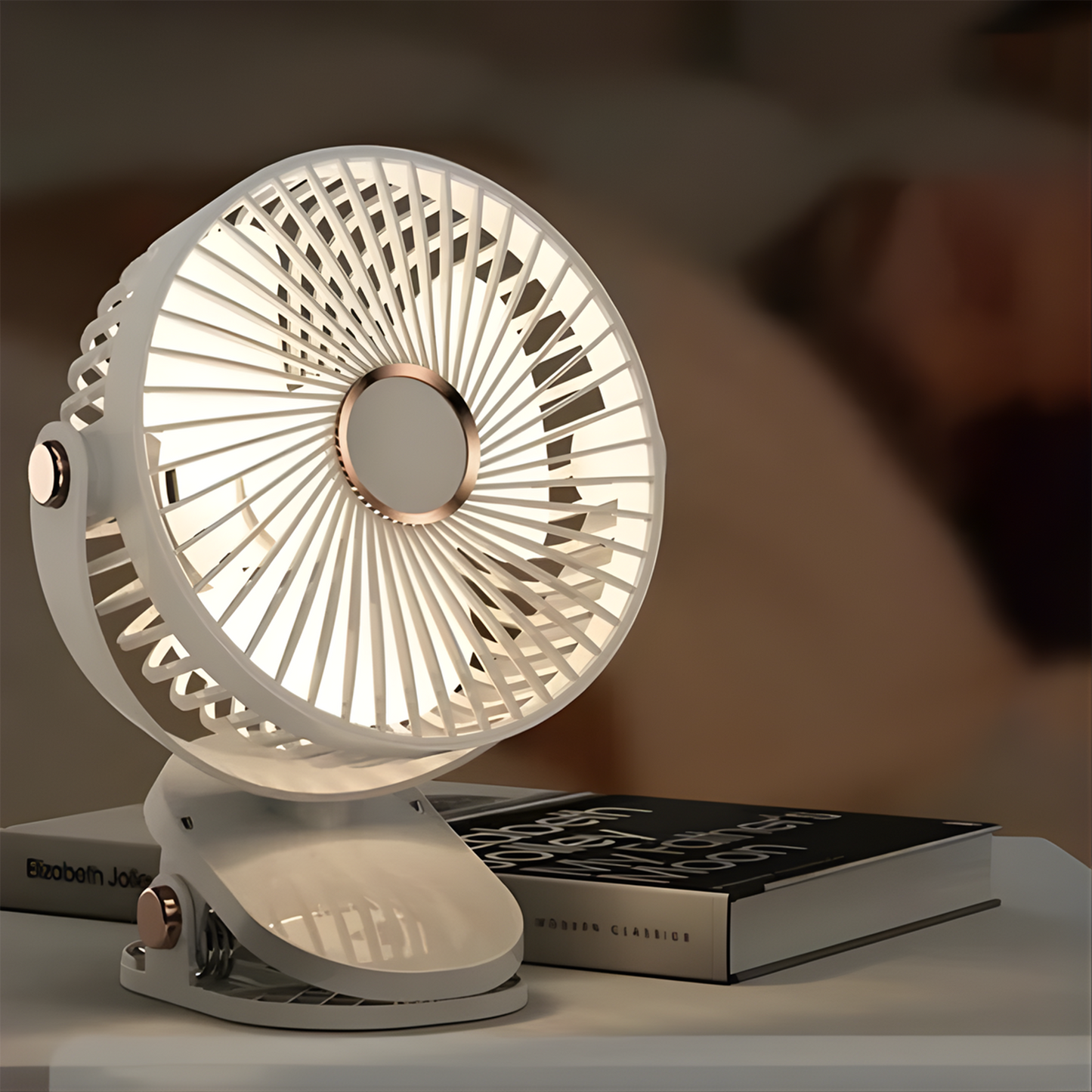 Portable mini fan showing clip stand and adjustable speed controls