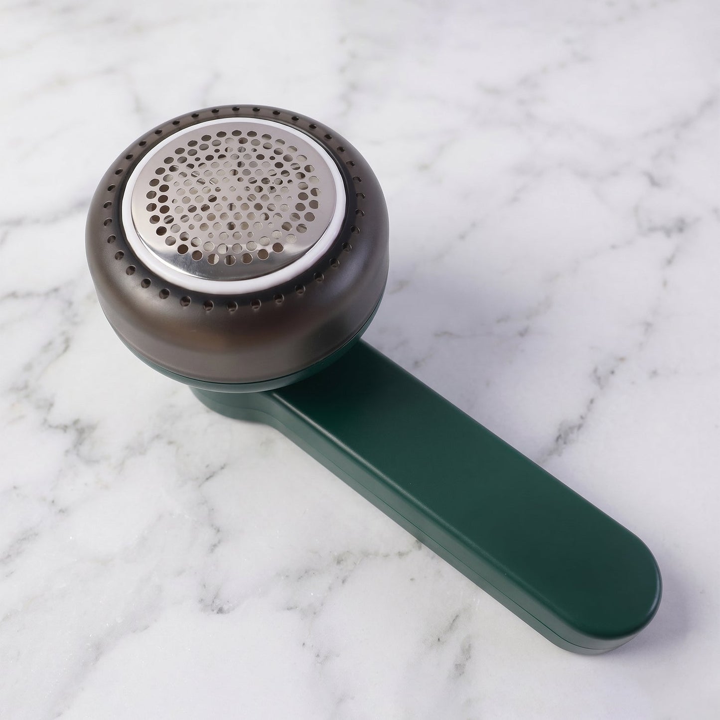 Side view of handheld lint remover