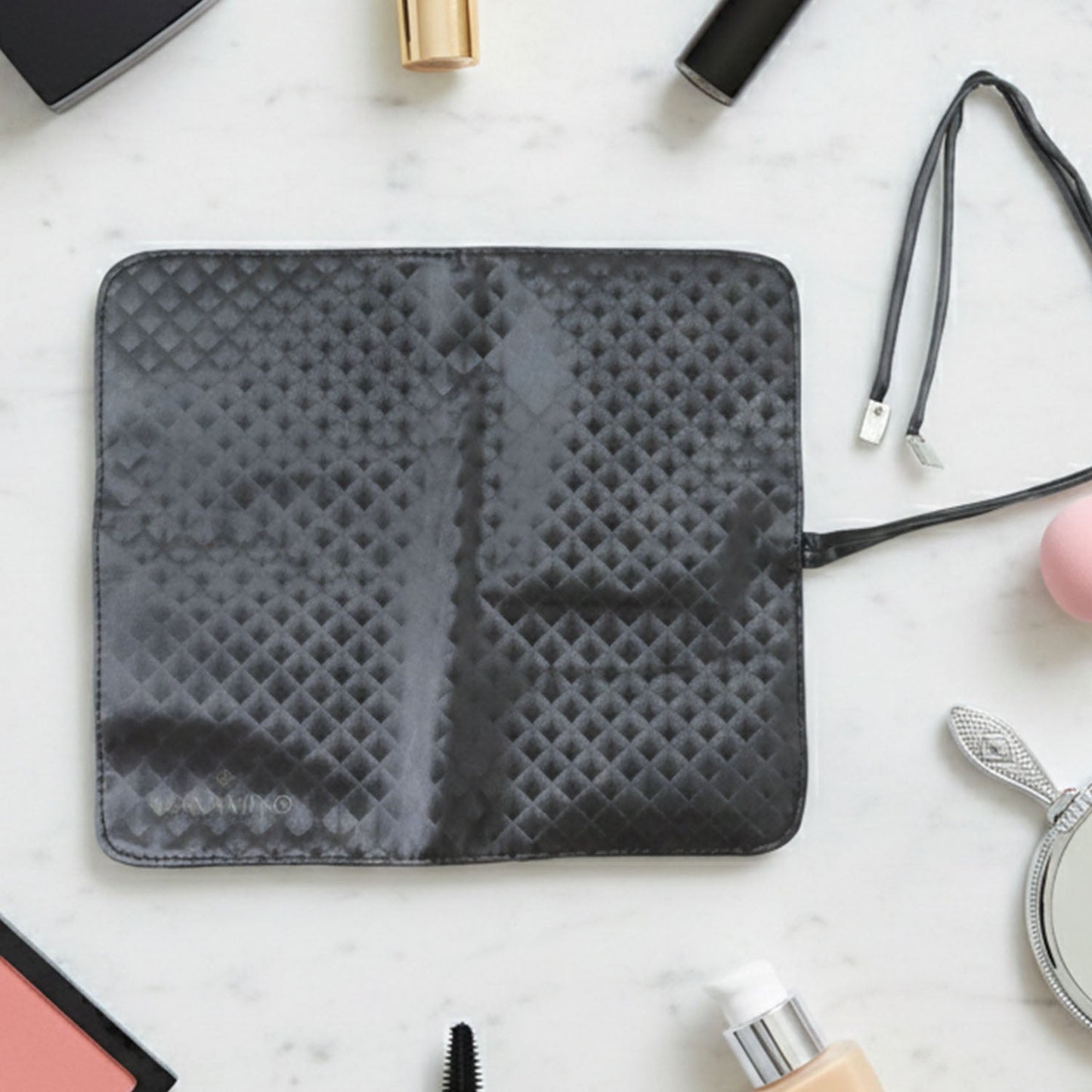 Makeup brush holder bag storing brushes separately in different slots for organisation