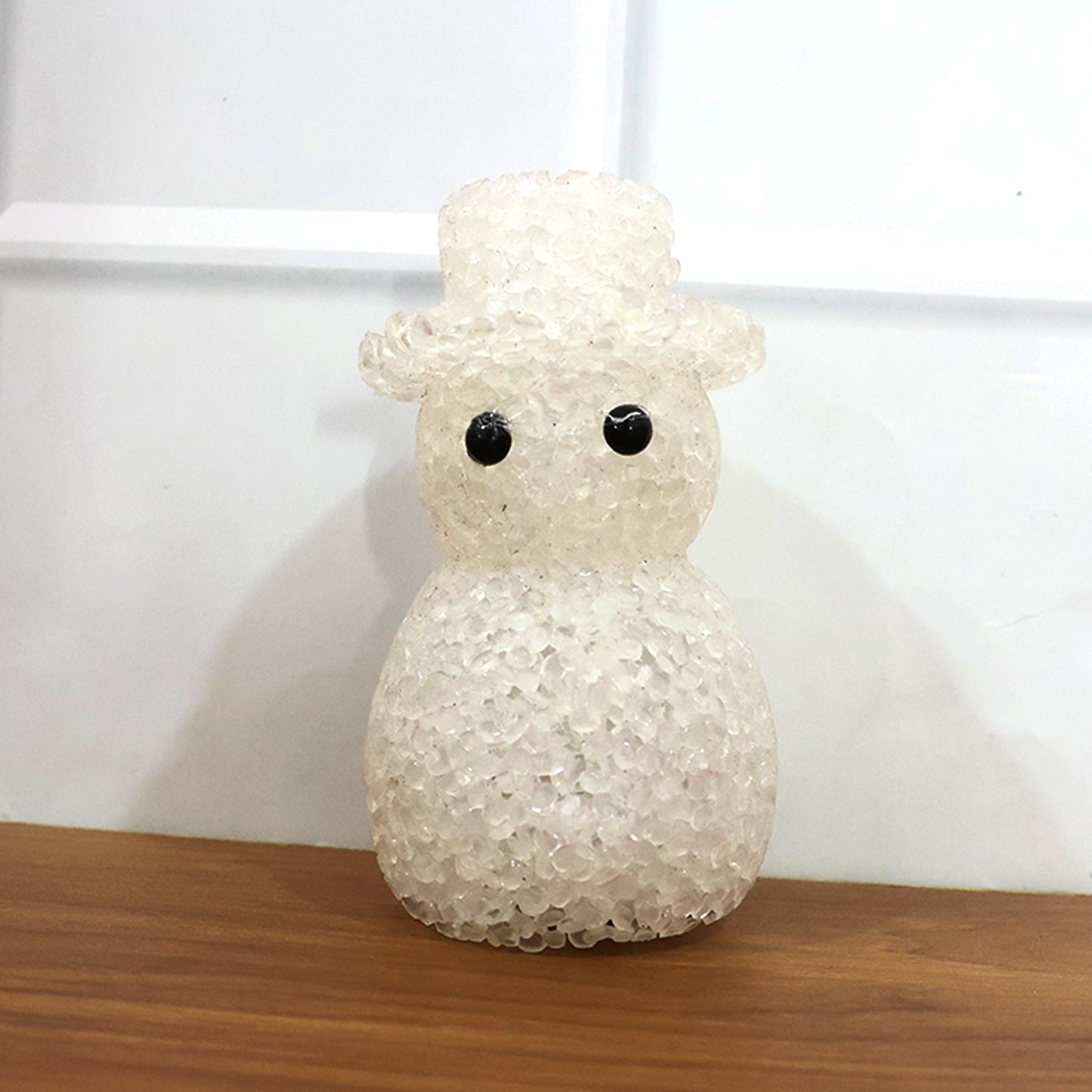 Close-up of snowman LED night lamp with decorative crystal-style finish