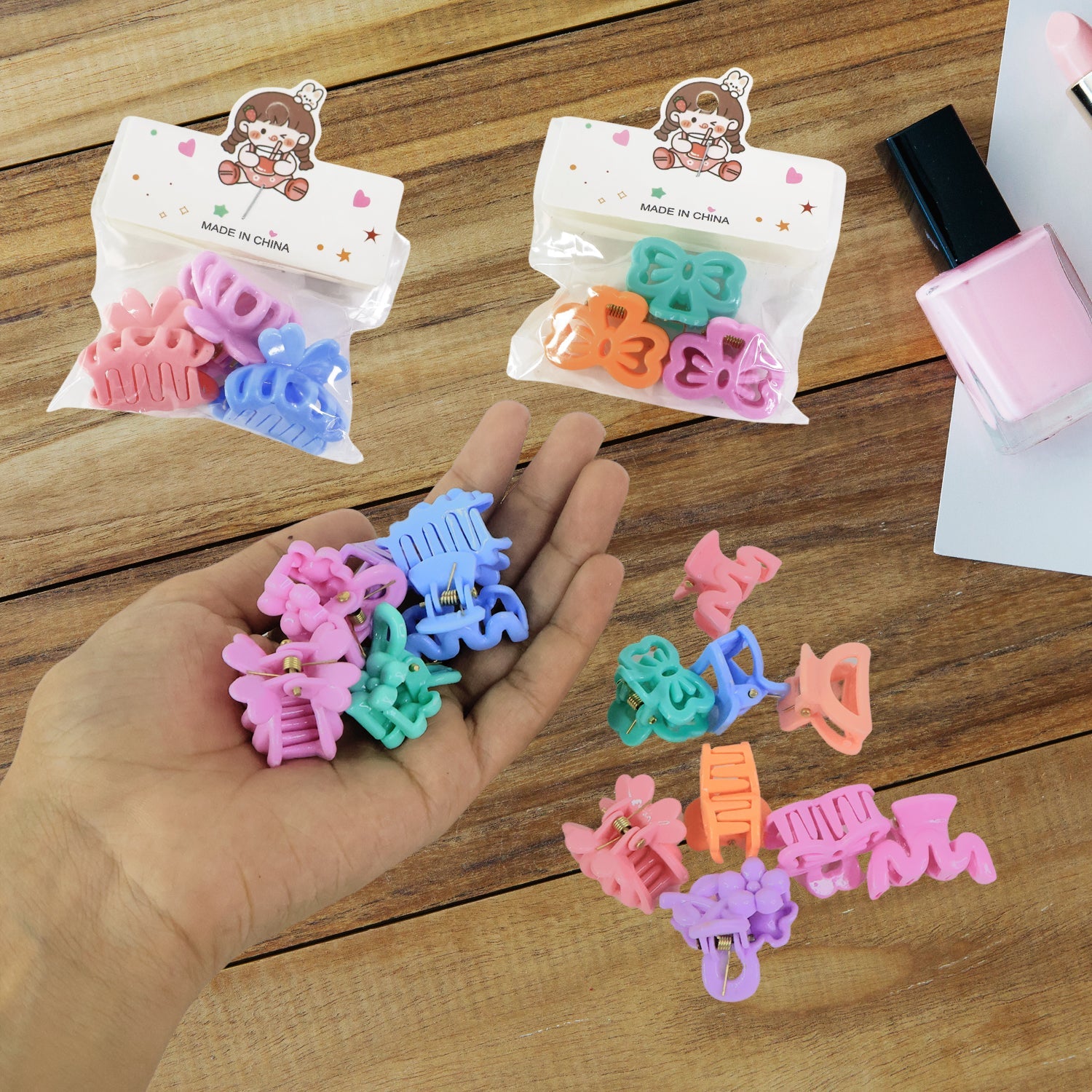 Varied designs of colourful mini hair clips for children, showcasing patterns.