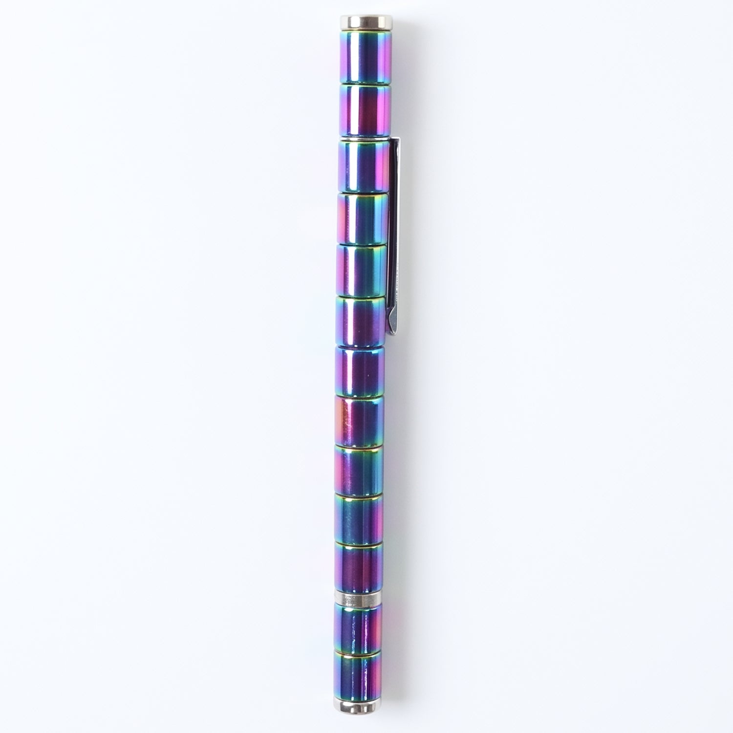 The magnetic pen creatively arranged into various abstract shapes on a desk.