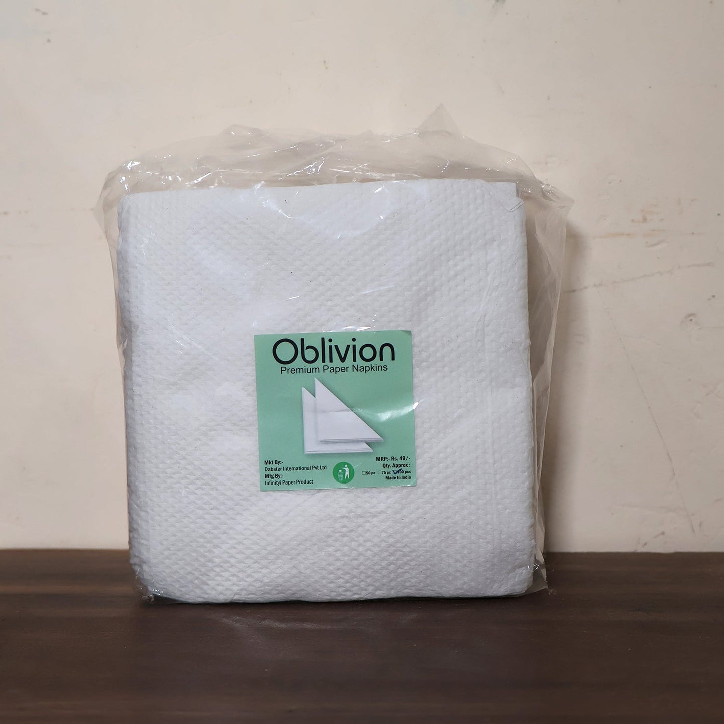 Multicolor tissue paper effectively cleaning a small spill on a kitchen surface.