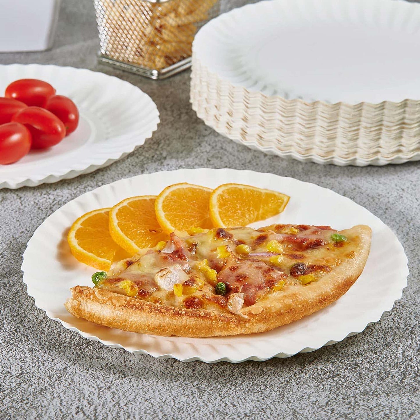 Freshee 7 inch compostable paper plate holding assorted snacks showing sturdy design.