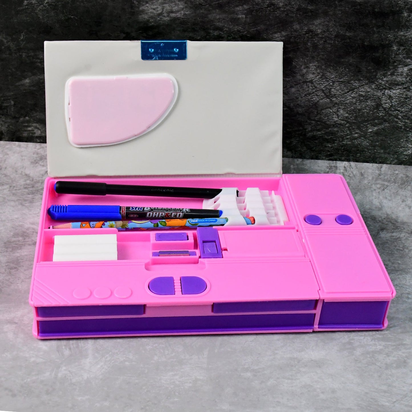 Close-up of magnetic closure on space-themed pencil box with calculator